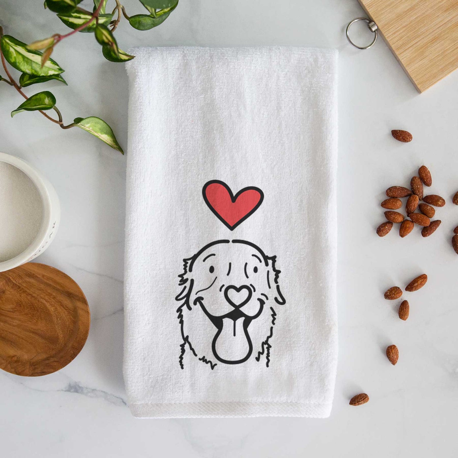 Minimalist line drawing of Maple the Golden Retriever with a red heart on a decorative hand towel