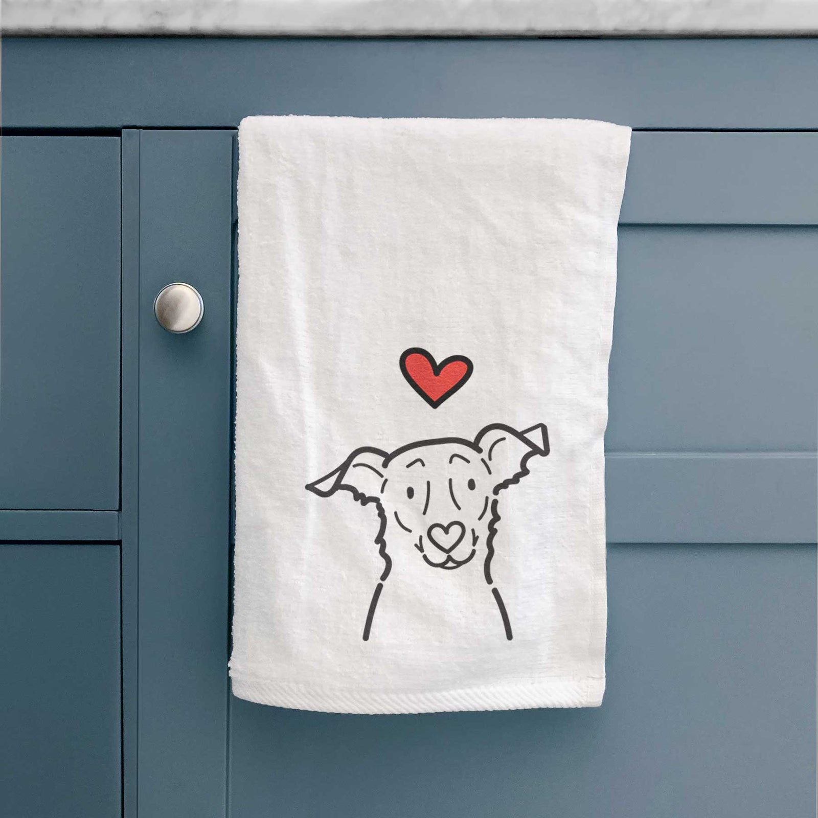 Minimalist line drawing of Millie the Border Collie Mix with a red heart on a decorative hand towel