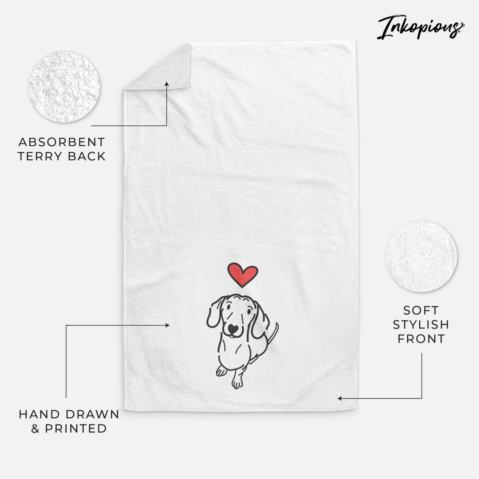 Minimalist line drawing of Moxie the Dachshund with a red heart on a decorative hand towel