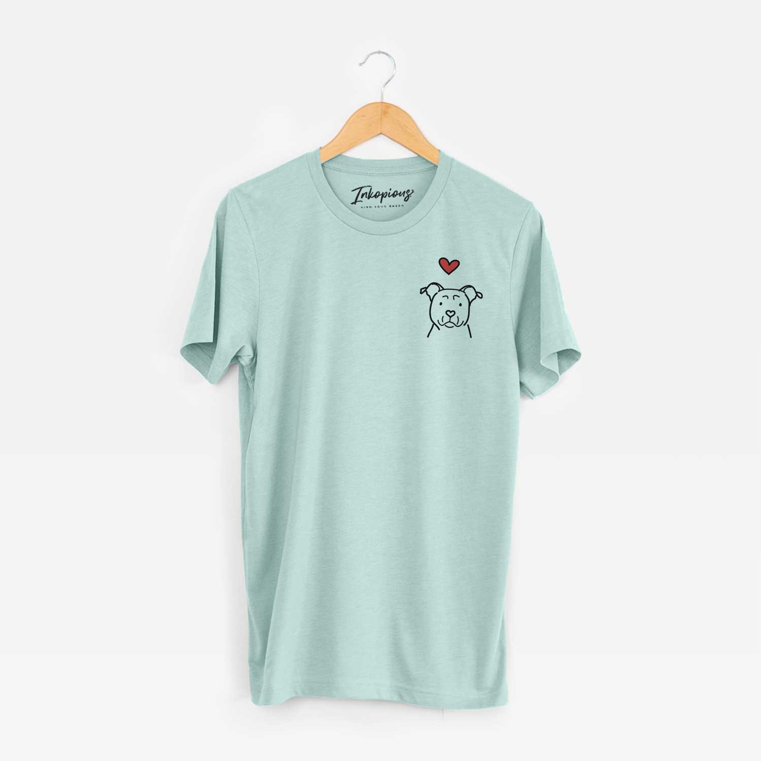 Small chest-pocket minimalist line drawing of an American Staffordshire Terrier with a red heart on a Heather Sage Unisex crewneck