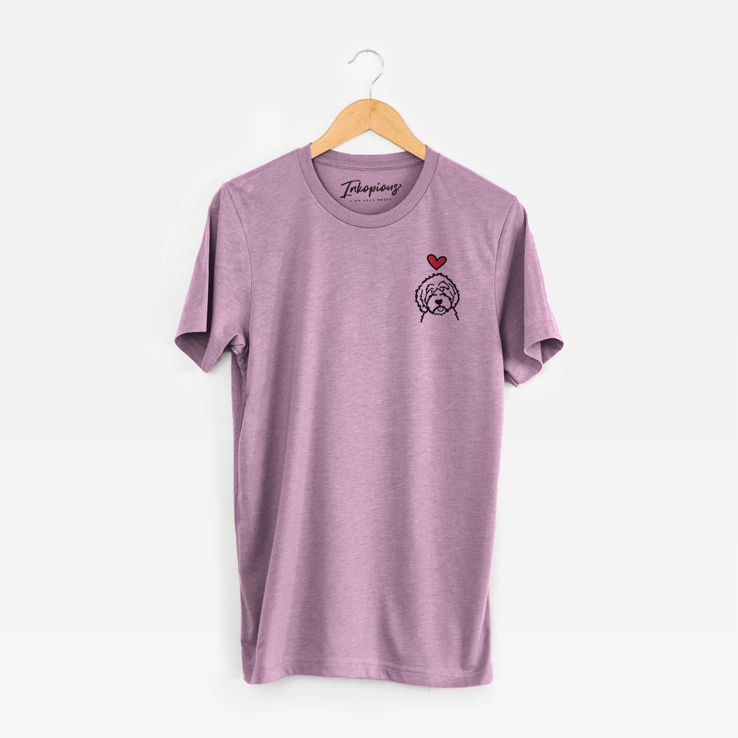 Small chest-pocket minimalist line drawing of an Aussiedoodle with a red heart on an Orchid Unisex crewneck