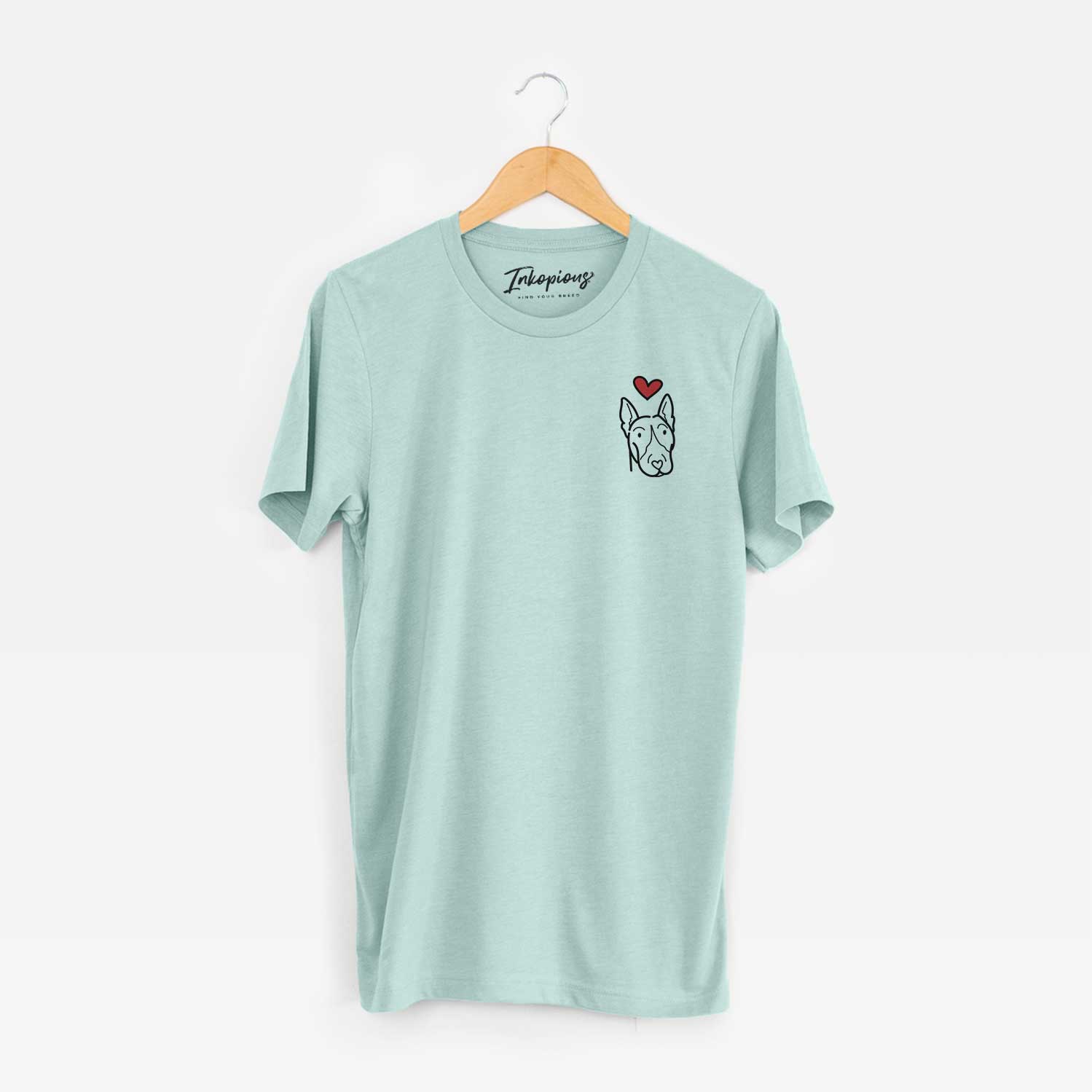 Small chest-pocket minimalist line drawing of a Bull Terrier with a red heart on a Heather Sage Unisex crewneck