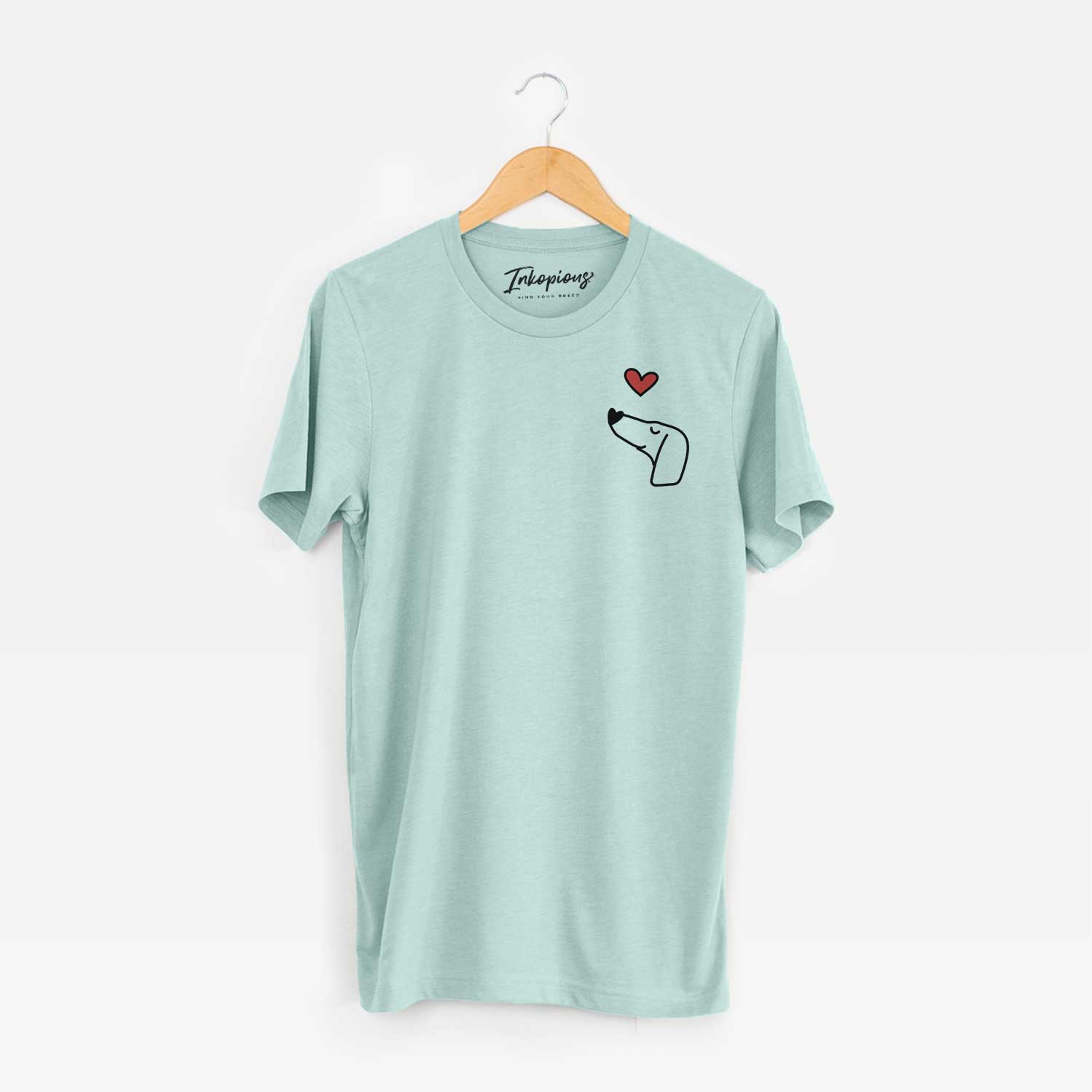 Small chest-pocket minimalist line drawing of a Dachshund with a red heart on a Heather Sage Unisex crewneck