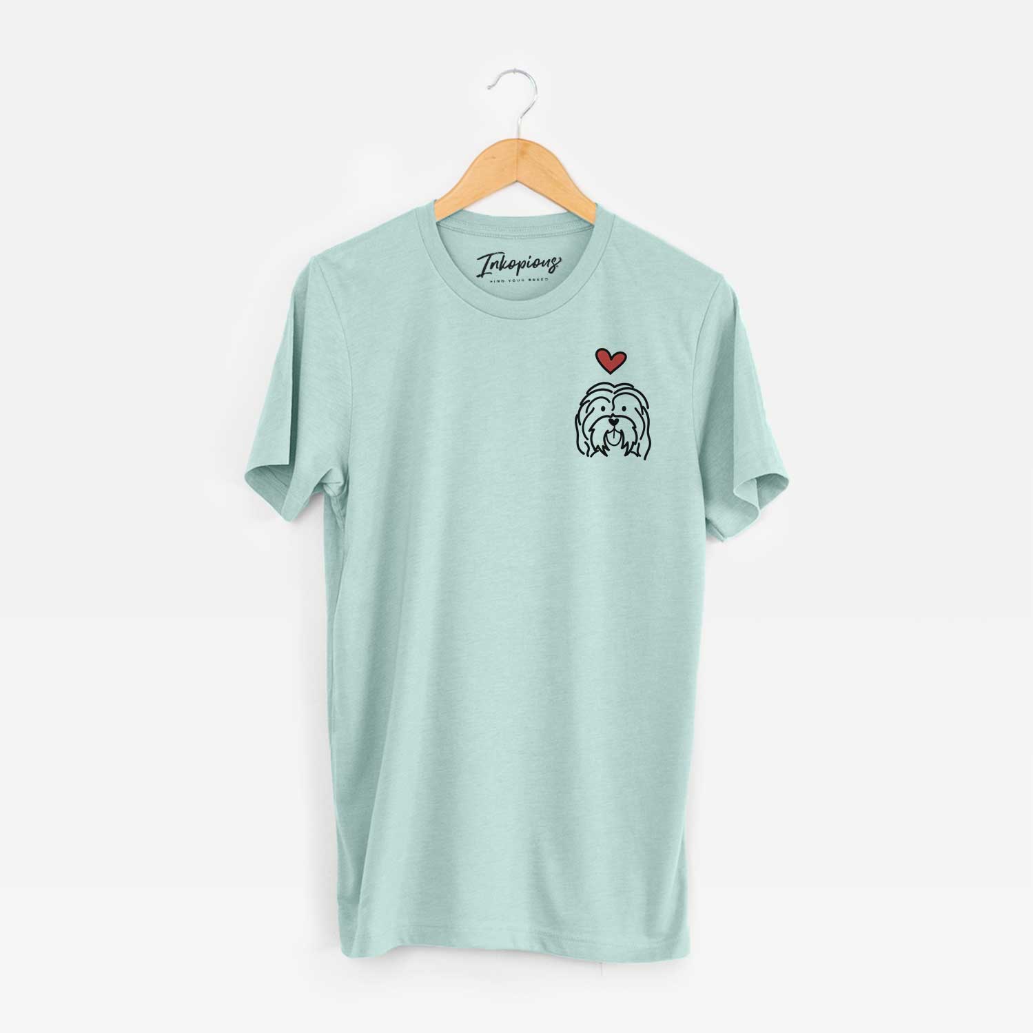 Small chest-pocket minimalist line drawing of a Havanese with a red heart on a Heather Sage Unisex crewneck