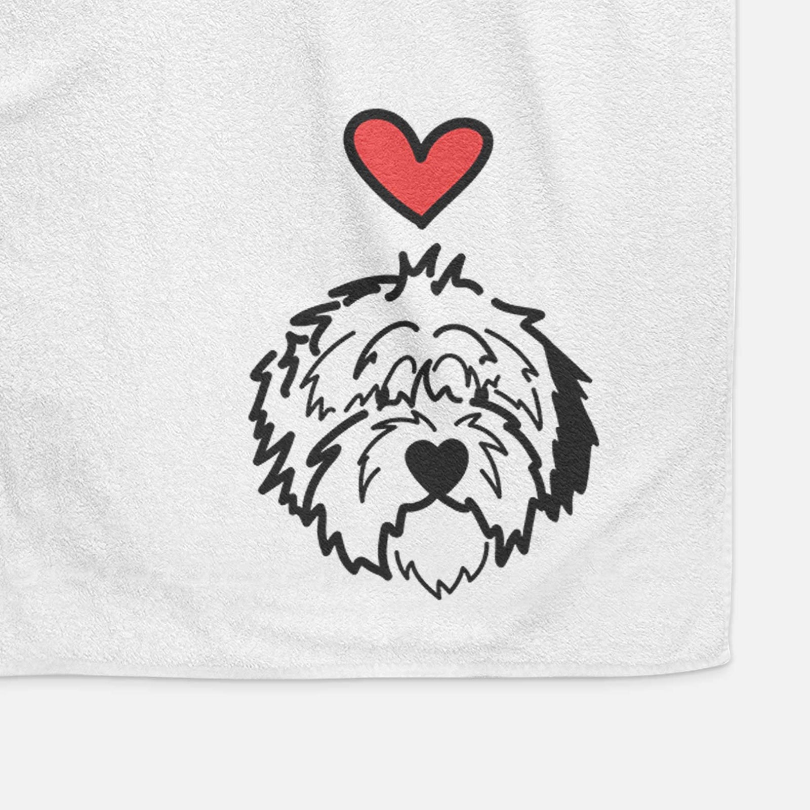 Minimalist line drawing of Penny the Old English Sheepdog with a red heart on a decorative hand towel