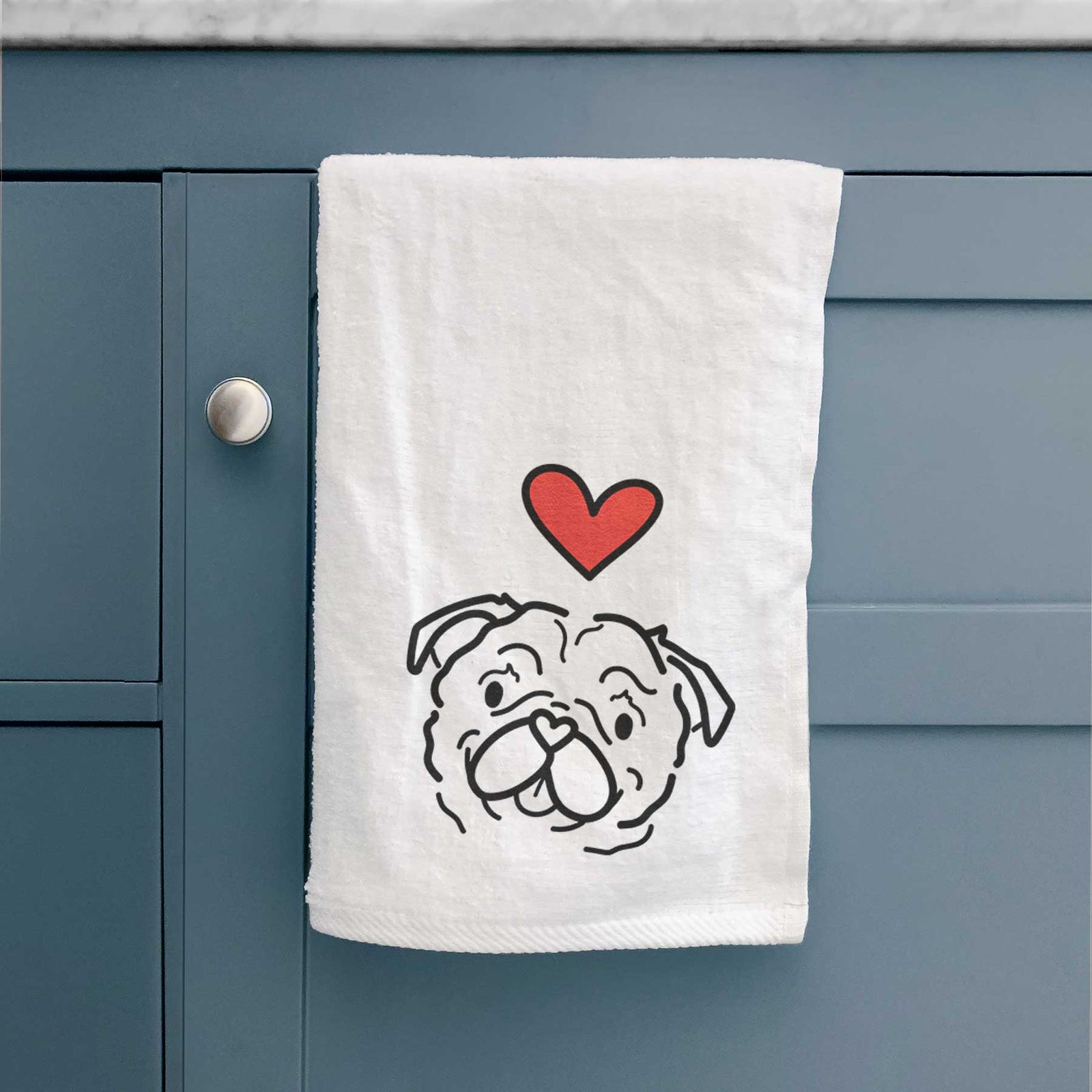 Minimalist line drawing of Pip the Pug with a red heart on a decorative hand towel