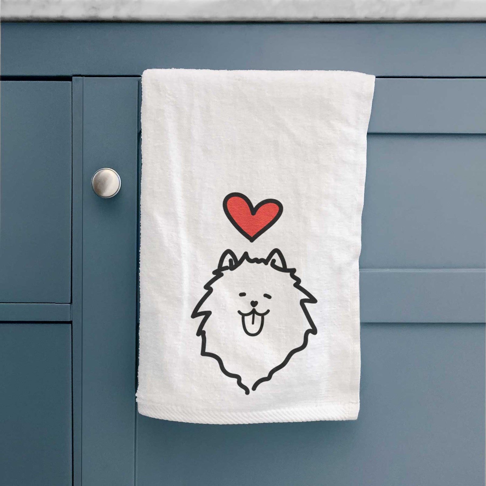 Minimalist line drawing of a Pomeranian with a red heart on a decorative hand towel