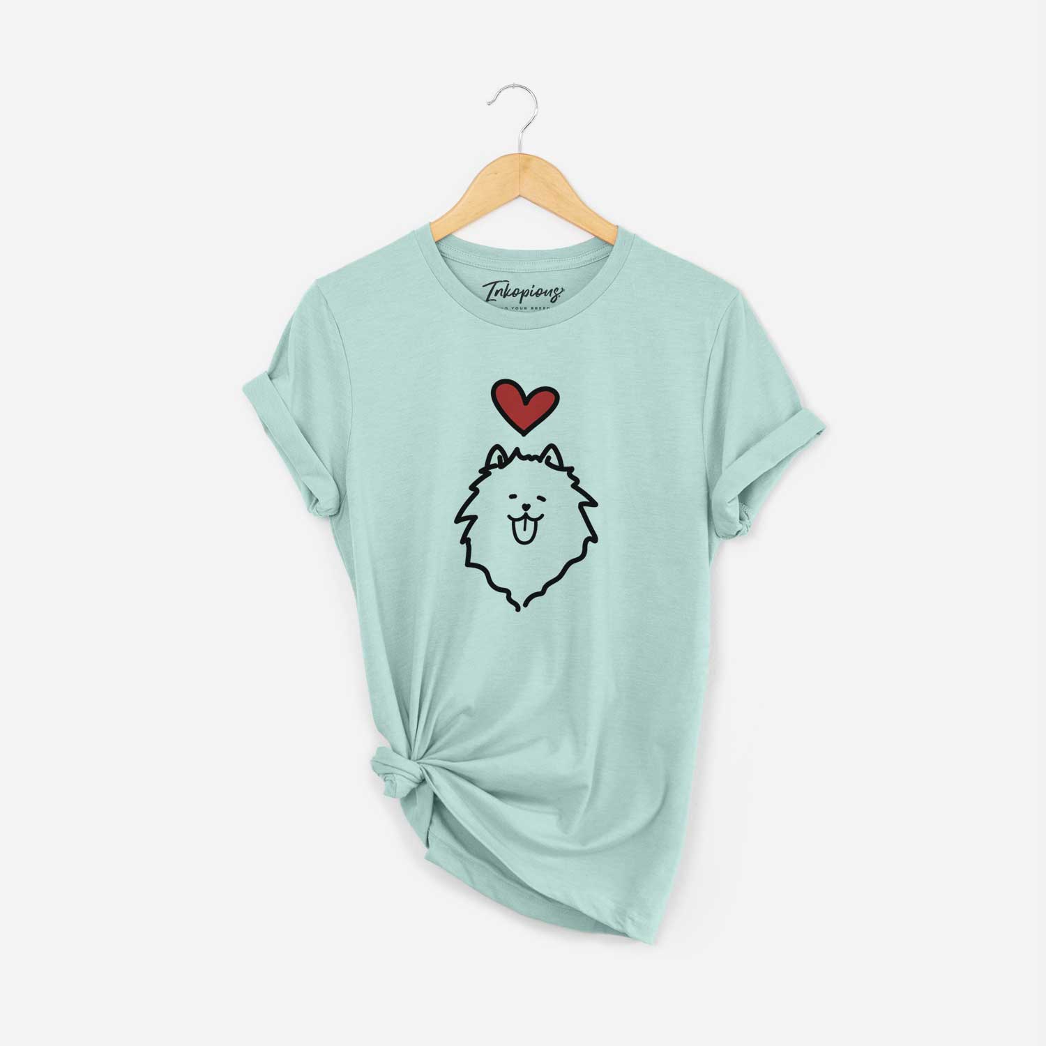 Minimalist line drawing of a Pomeranian with a red heart on a Heather Sage Unisex crewneck