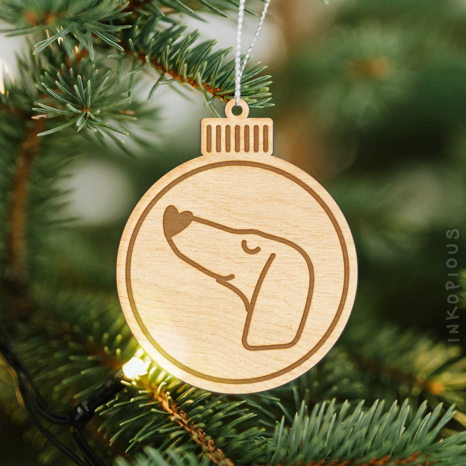 Minimalist line drawing of a Dachshund with a red heart on an Ornament wooden ornament