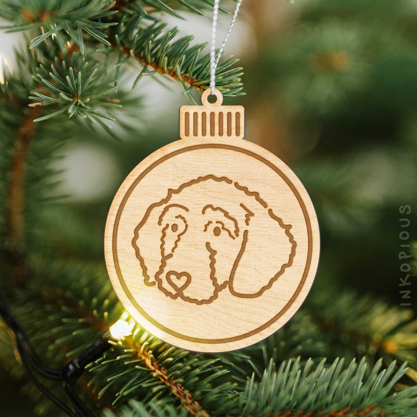 Minimalist line drawing of Hanna the Goldendoodle with a red heart on an Ornament wooden ornament