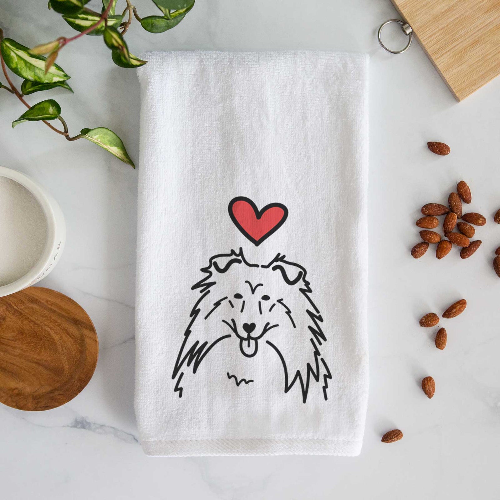 Minimalist line drawing of a Rough Collie with a red heart on a decorative hand towel