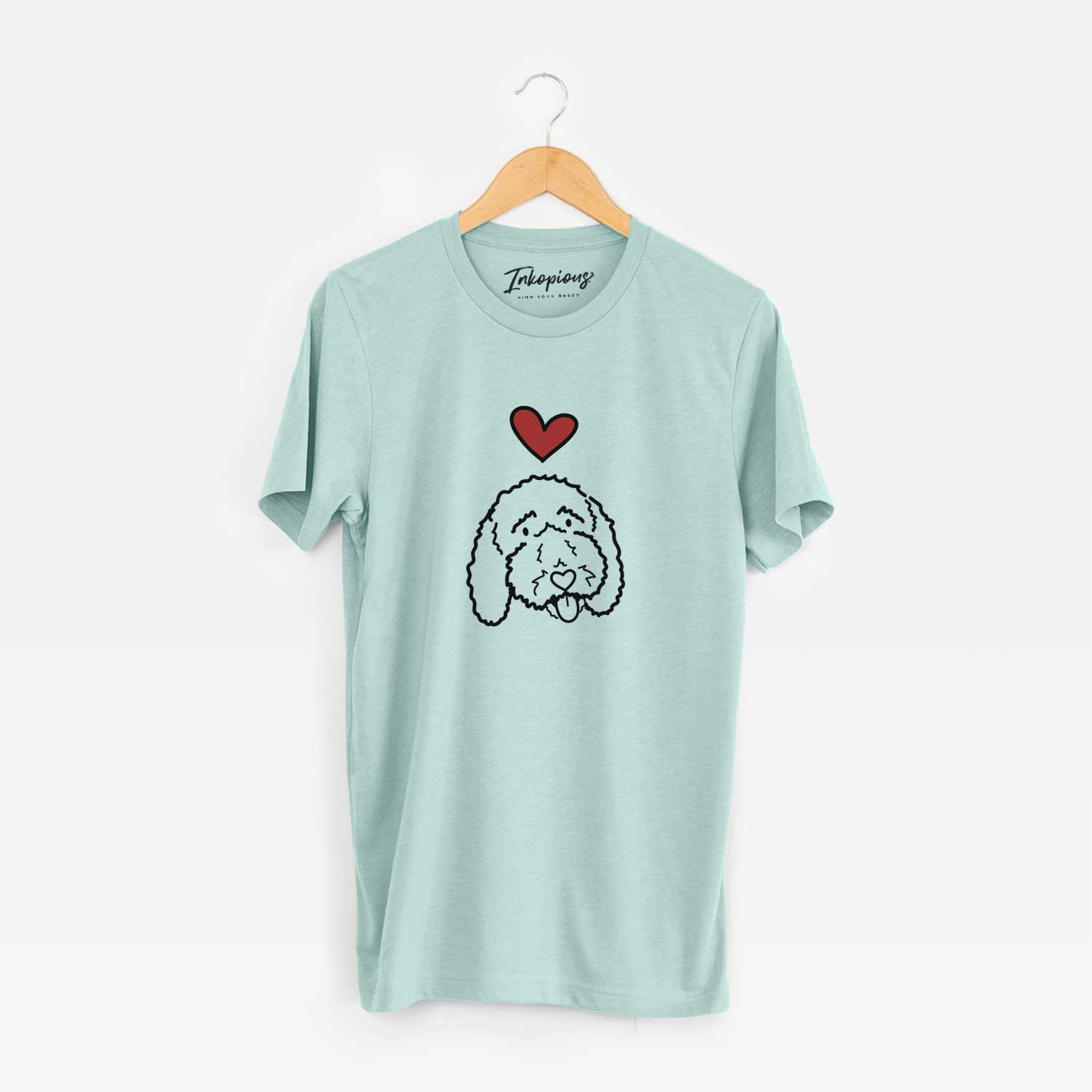 Minimalist line drawing of Ruby the Bernedoodle with a red heart on a Heather Sage Unisex crewneck