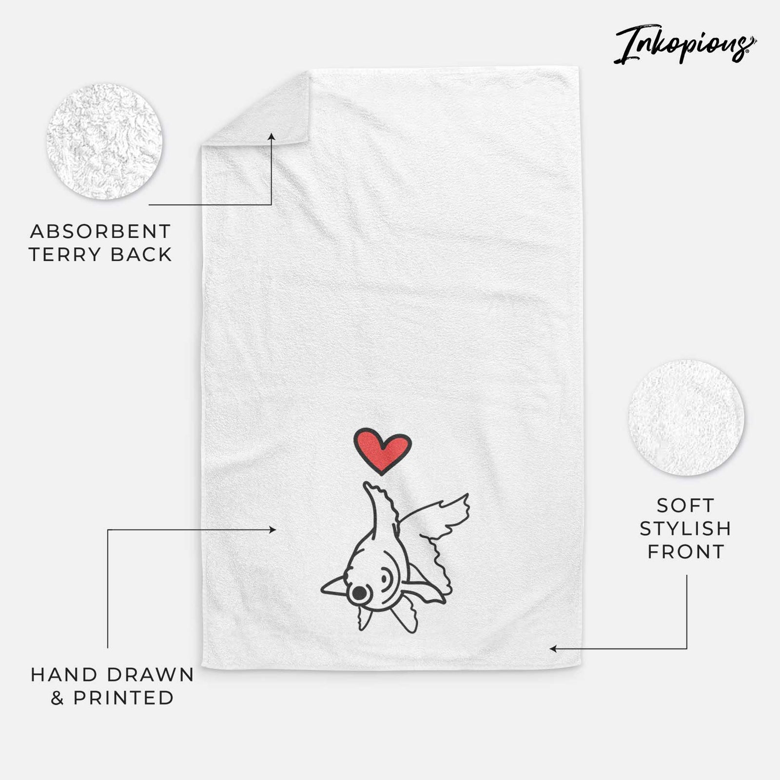 Minimalist line drawing of Ruby the Goldfish with a red heart on a decorative hand towel