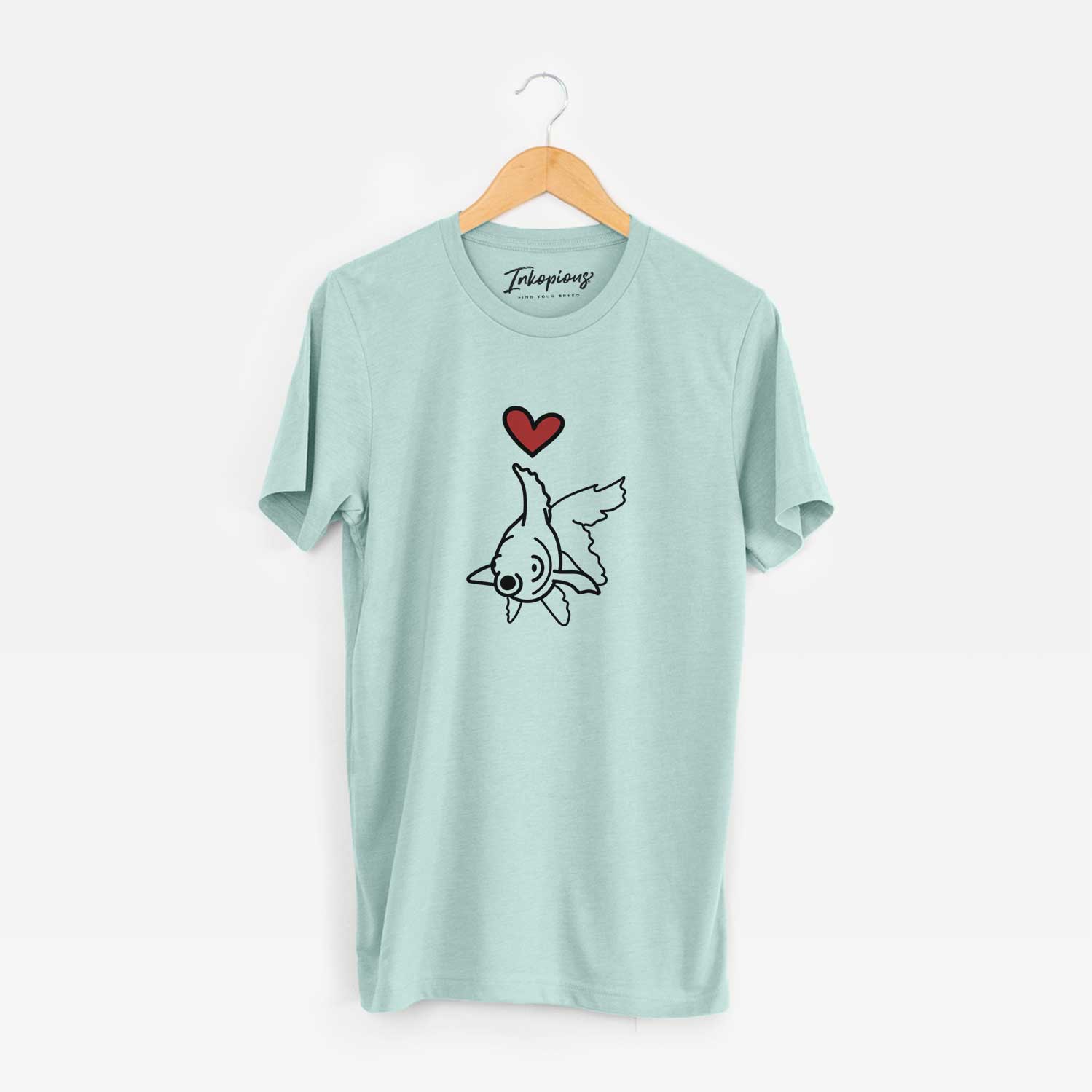 Minimalist line drawing of Ruby the Goldfish with a red heart on a Heather Sage Unisex crewneck