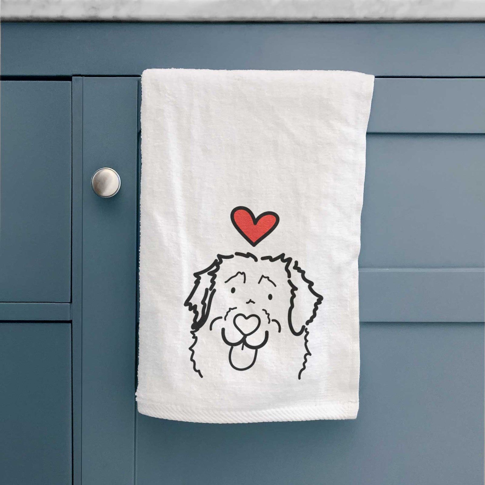 Minimalist line drawing of Sabre the Leonberger with a red heart on a decorative hand towel