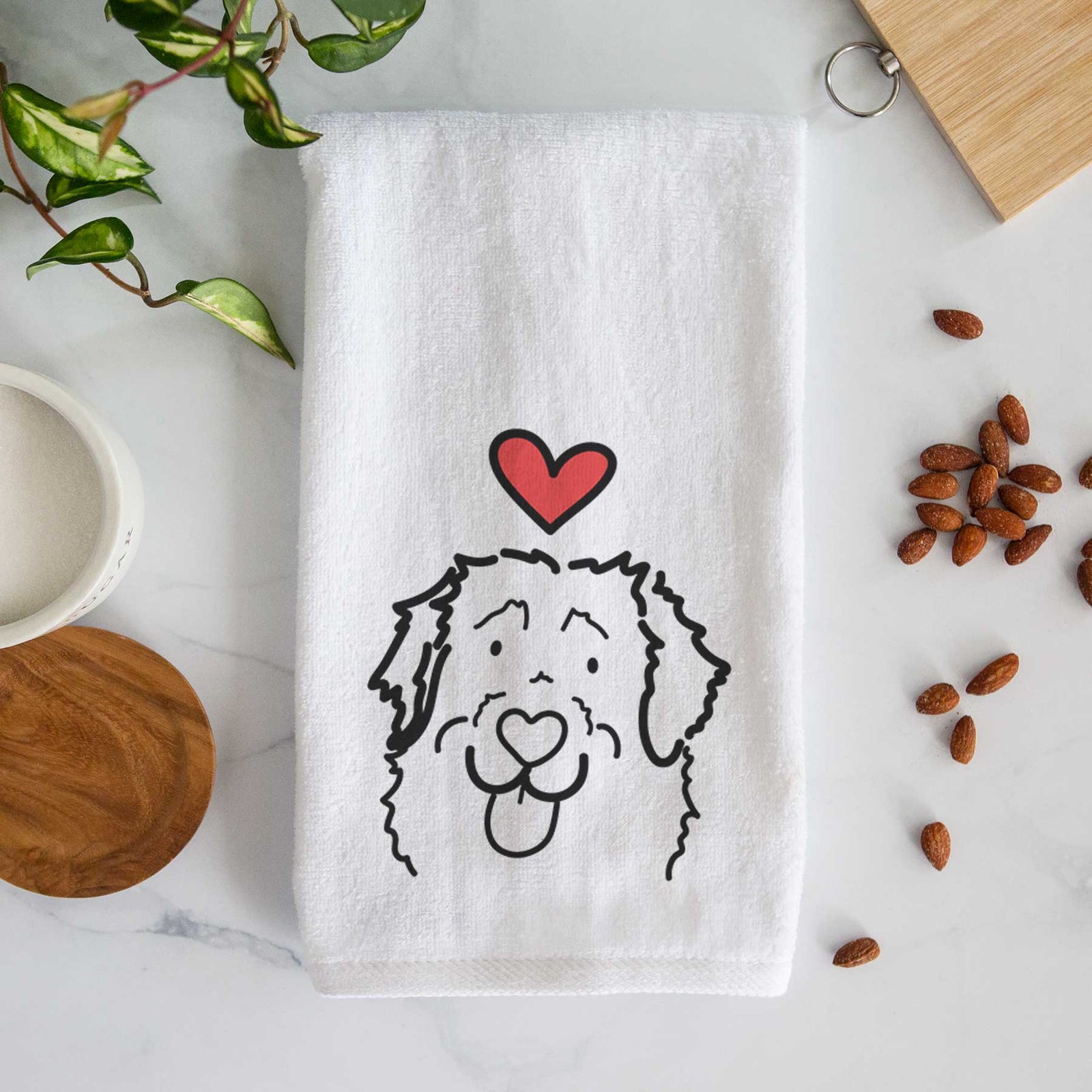 Minimalist line drawing of Sabre the Leonberger with a red heart on a decorative hand towel