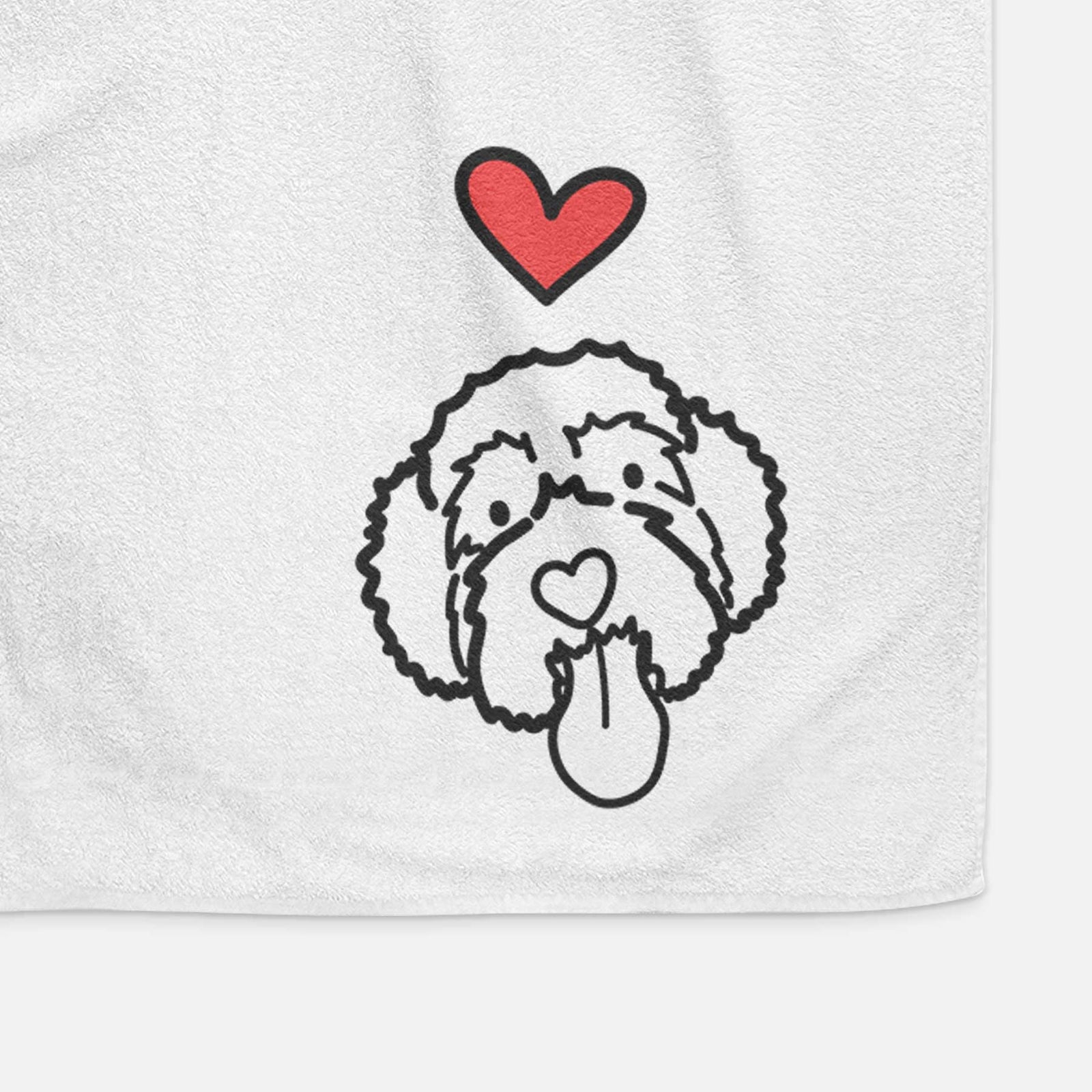 Minimalist line drawing of Sam the Portguese Water Dog with a red heart on a decorative hand towel