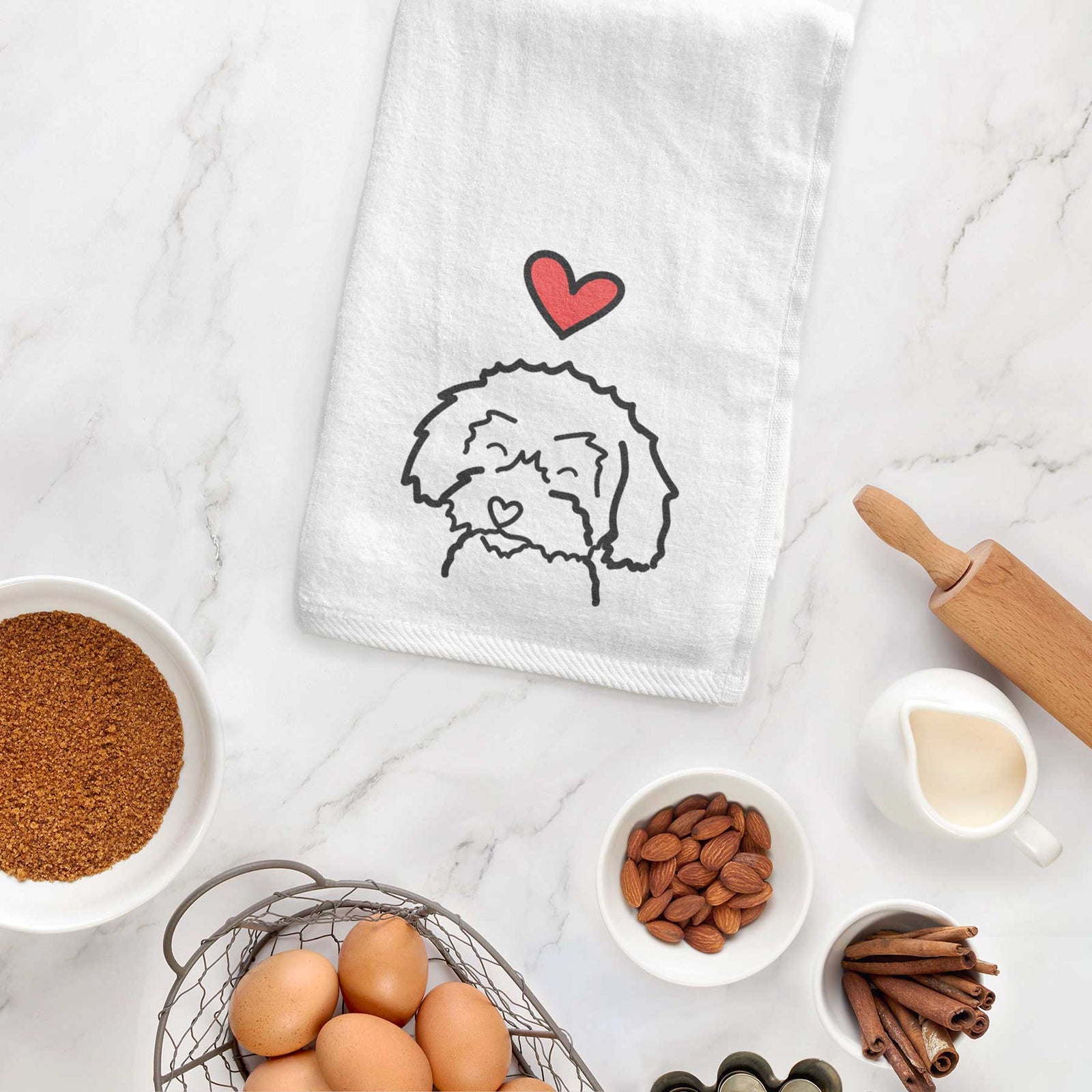 Minimalist line drawing of a Schnoodle with a red heart on a decorative hand towel