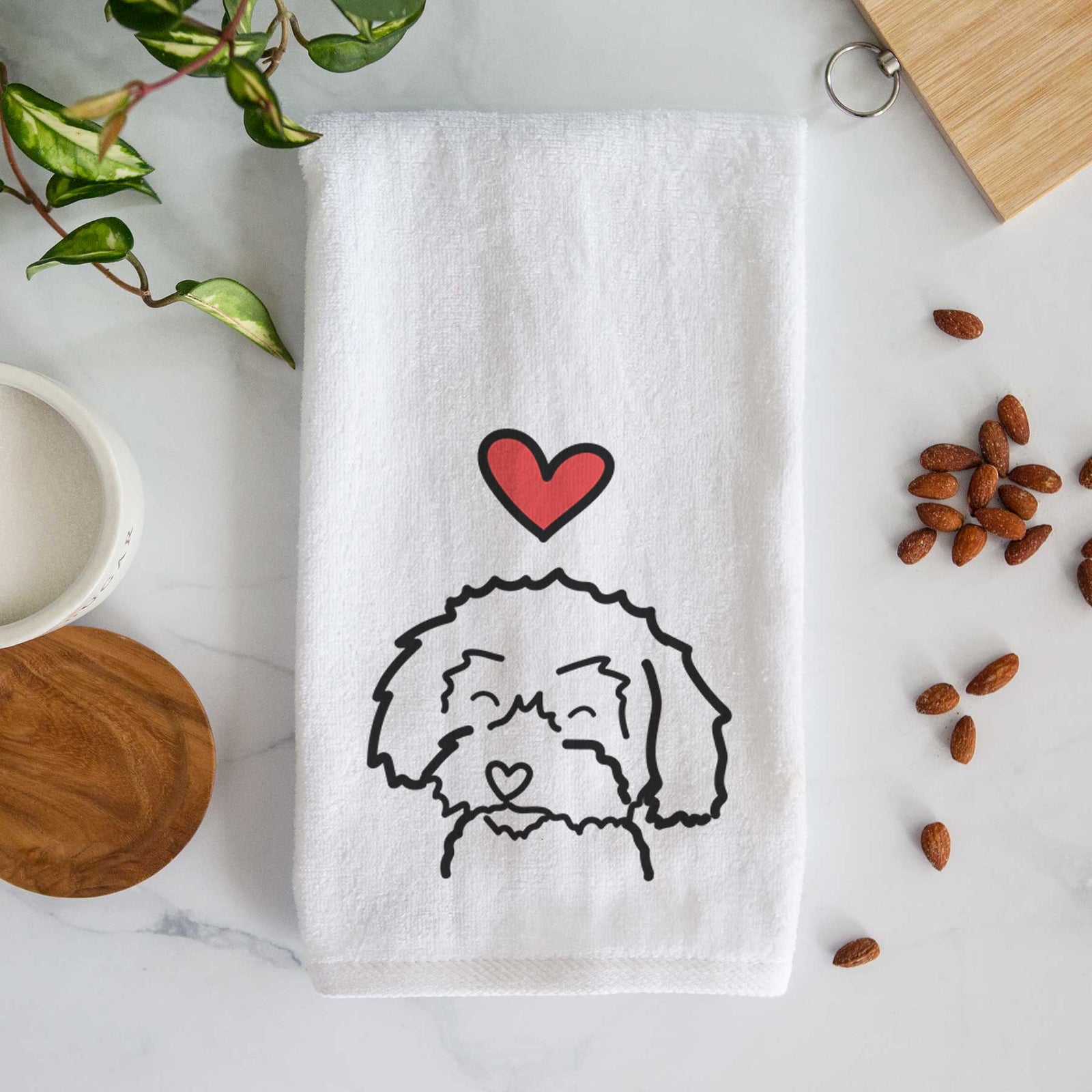 Minimalist line drawing of a Schnoodle with a red heart on a decorative hand towel