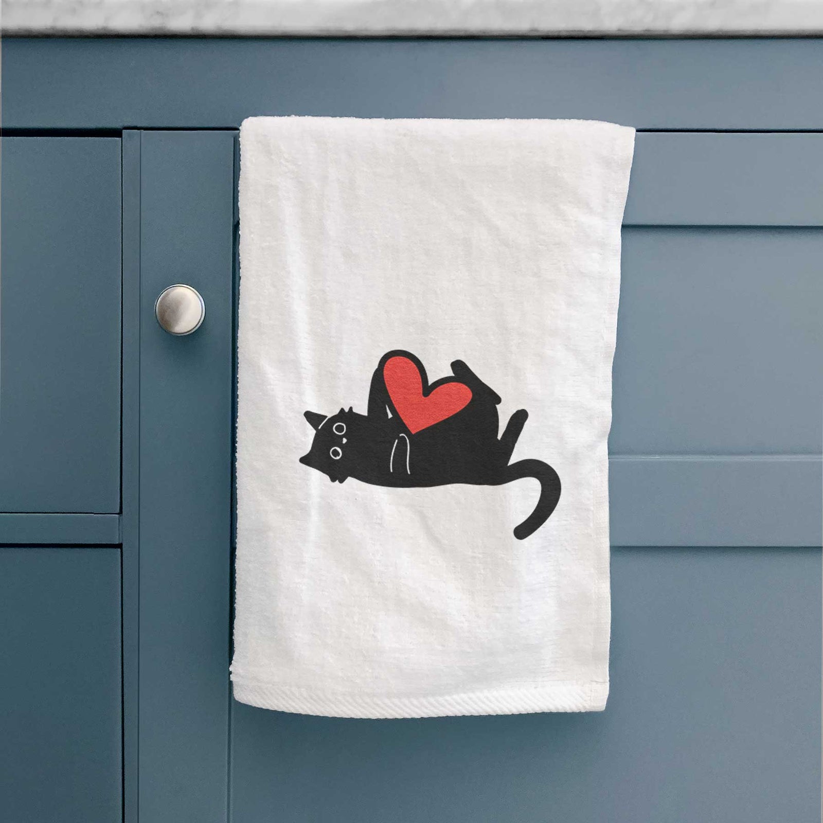Minimalist line drawing of Smash the Black Cat with a red heart on a decorative hand towel