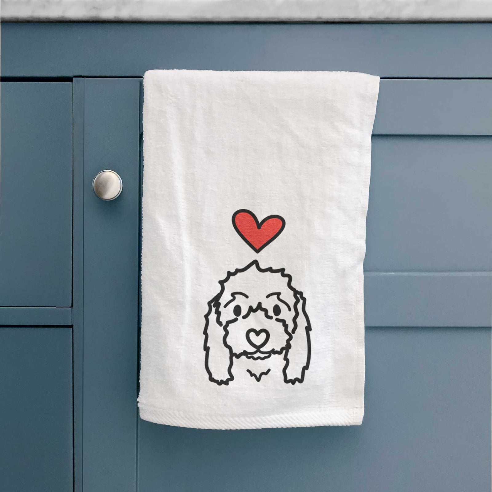 Minimalist line drawing of Sophie the Coton de Tulear with a red heart on a decorative hand towel
