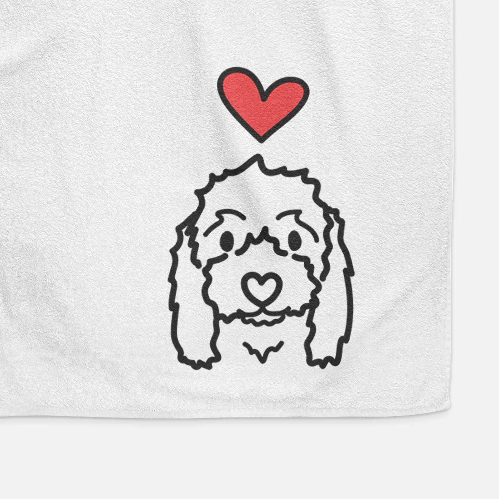 Minimalist line drawing of Sophie the Coton de Tulear with a red heart on a decorative hand towel