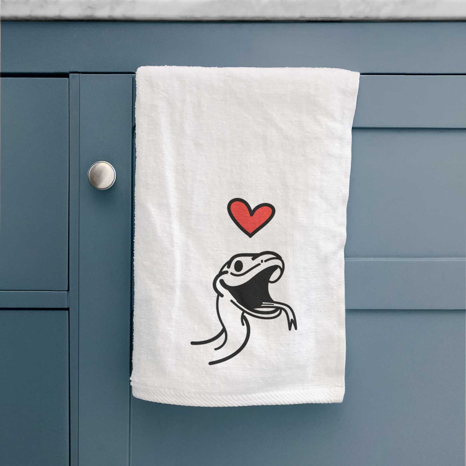 Minimalist line drawing of Spike the Snake with a red heart on a decorative hand towel