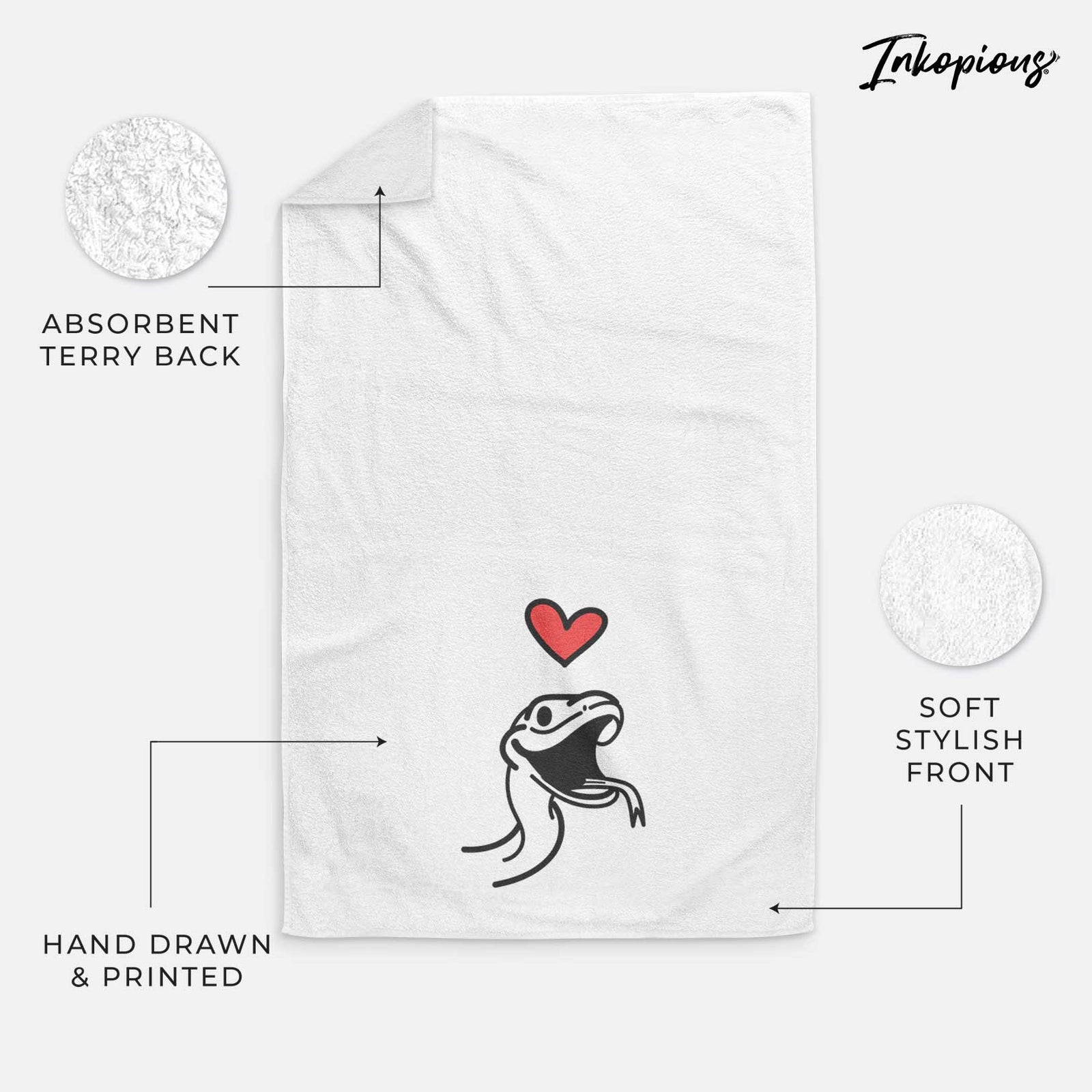 Minimalist line drawing of Spike the Snake with a red heart on a decorative hand towel