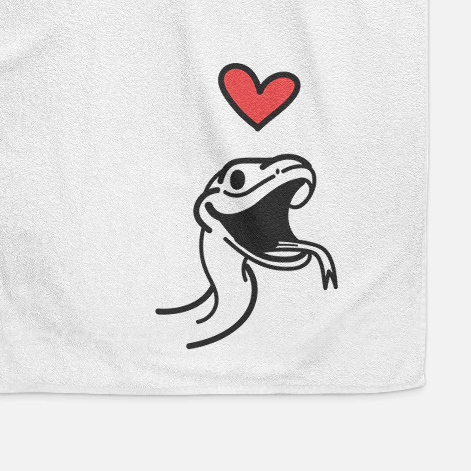 Minimalist line drawing of Spike the Snake with a red heart on a decorative hand towel