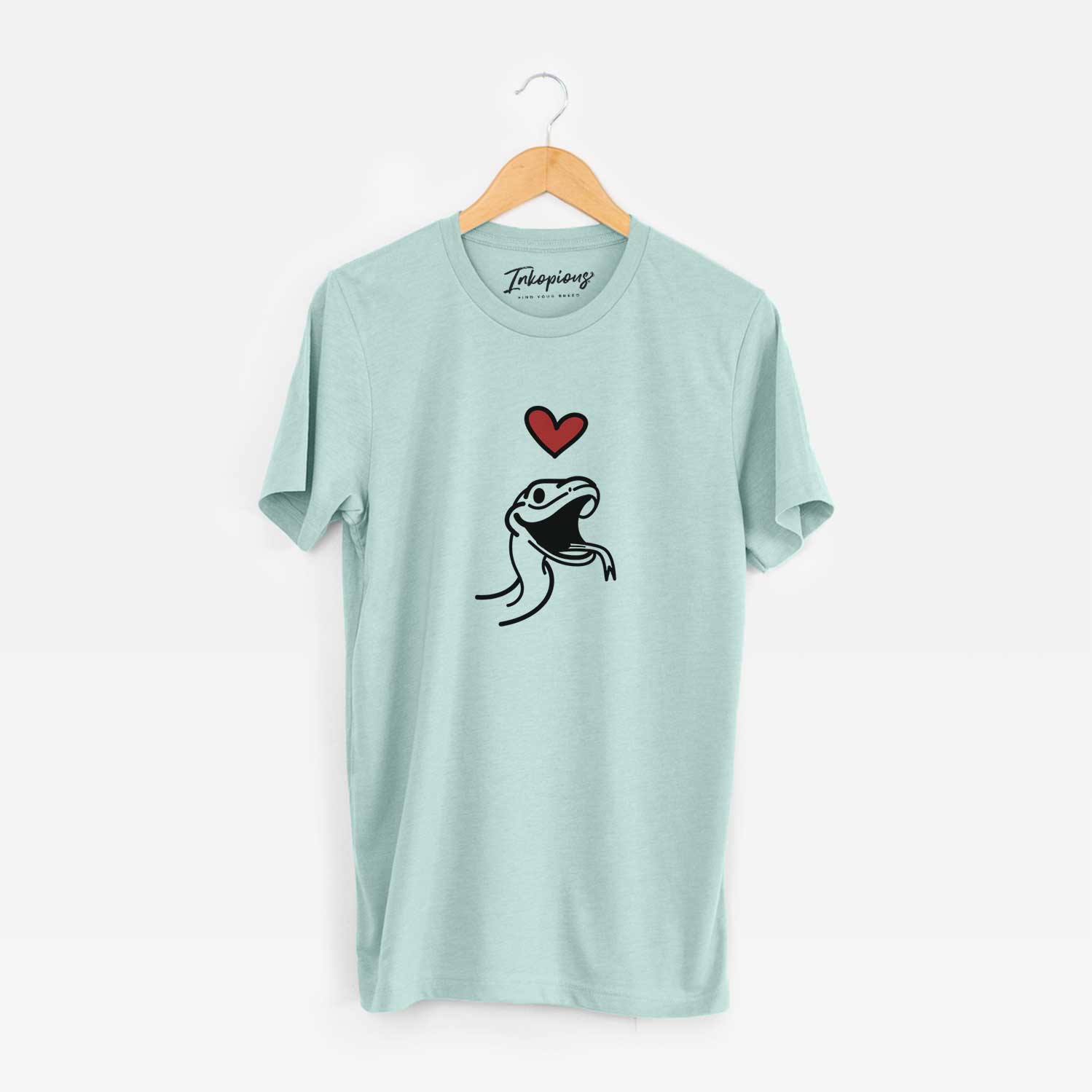 Minimalist line drawing of Spike the Snake with a red heart on a Heather Sage Unisex crewneck