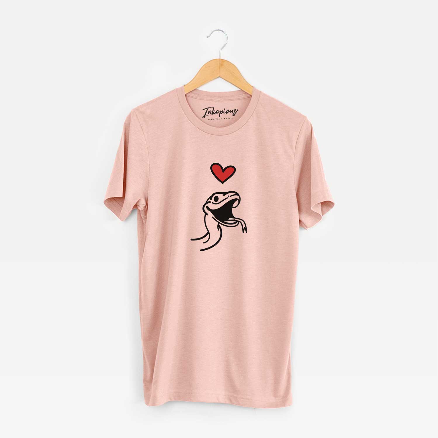 Minimalist line drawing of Spike the Snake with a red heart on a Peach Unisex crewneck
