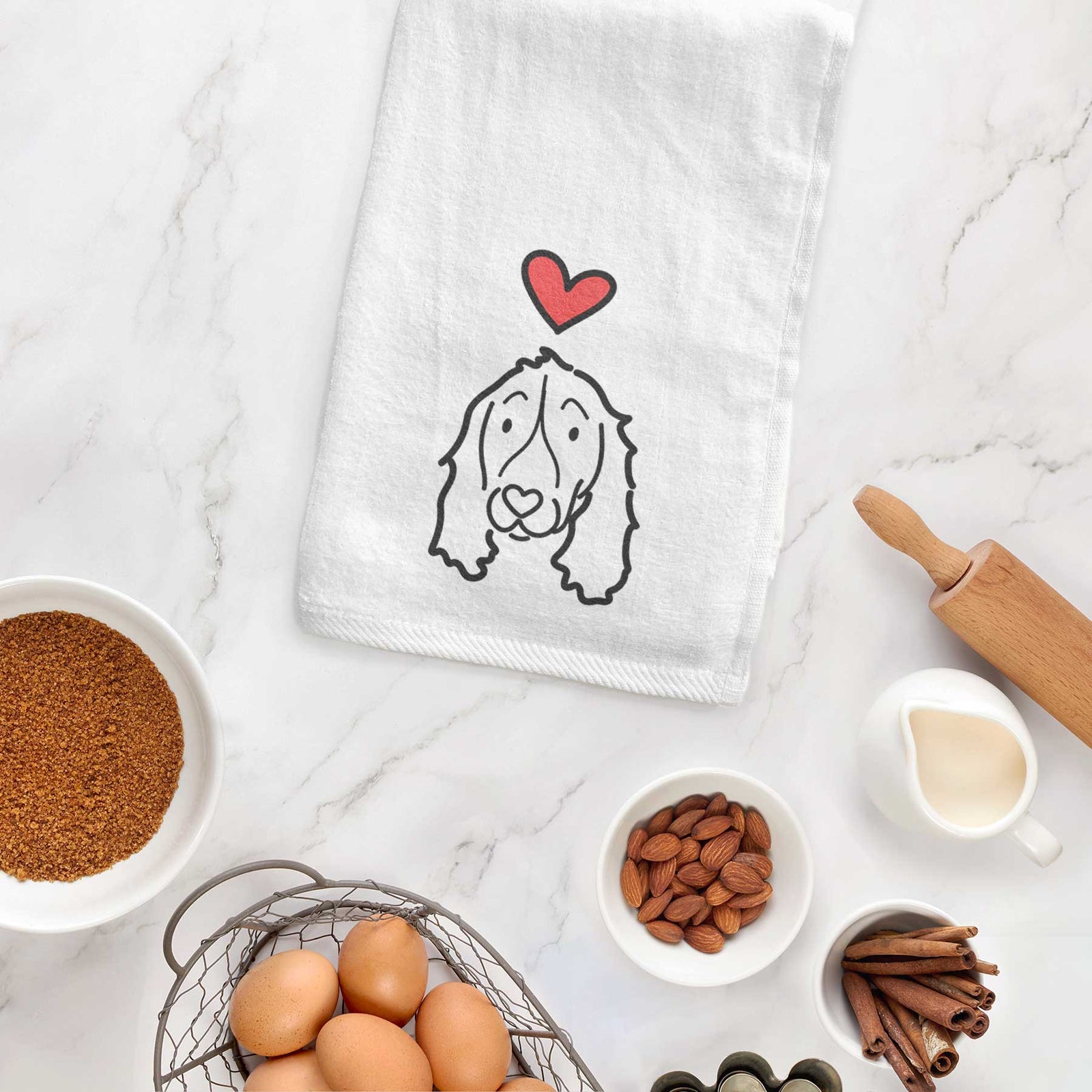 Minimalist line drawing of an English Springer Spaniel with a red heart on a decorative hand towel