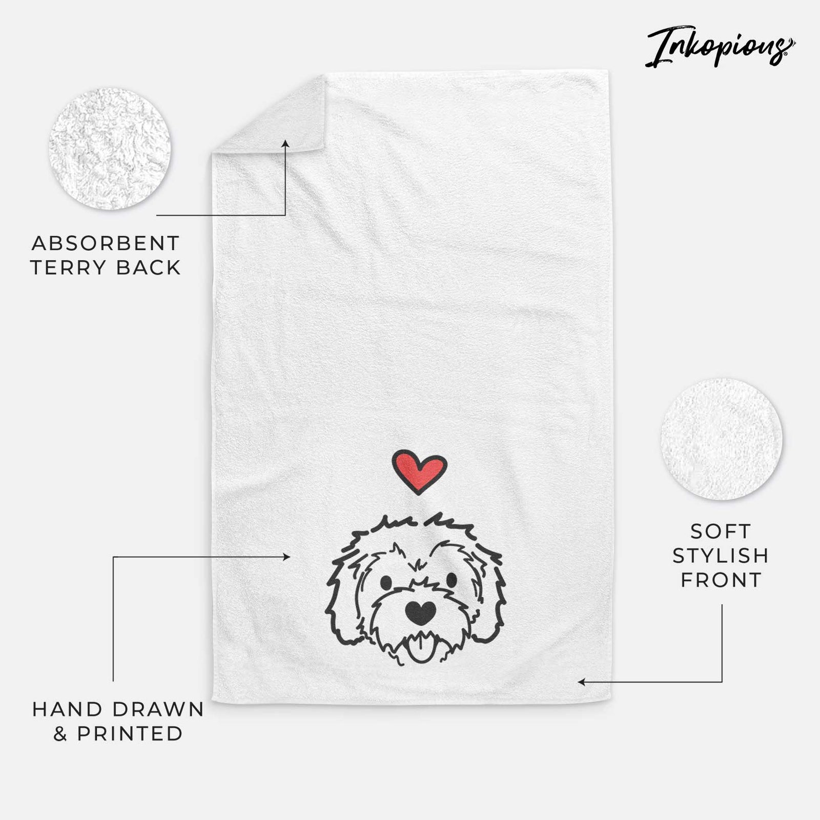 Minimalist line drawing of Sprinkles the Cockapoo with a red heart on a decorative hand towel