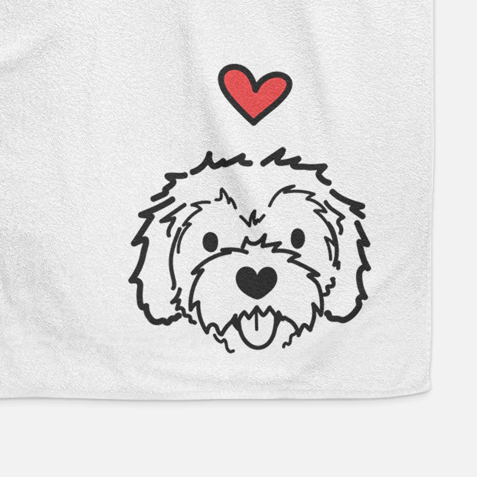 Minimalist line drawing of Sprinkles the Cockapoo with a red heart on a decorative hand towel