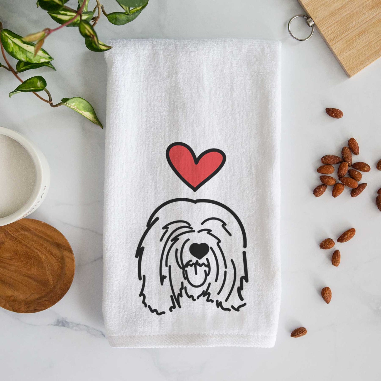 Minimalist line drawing of Stan the Tibetan Mastiff with a red heart on a decorative hand towel