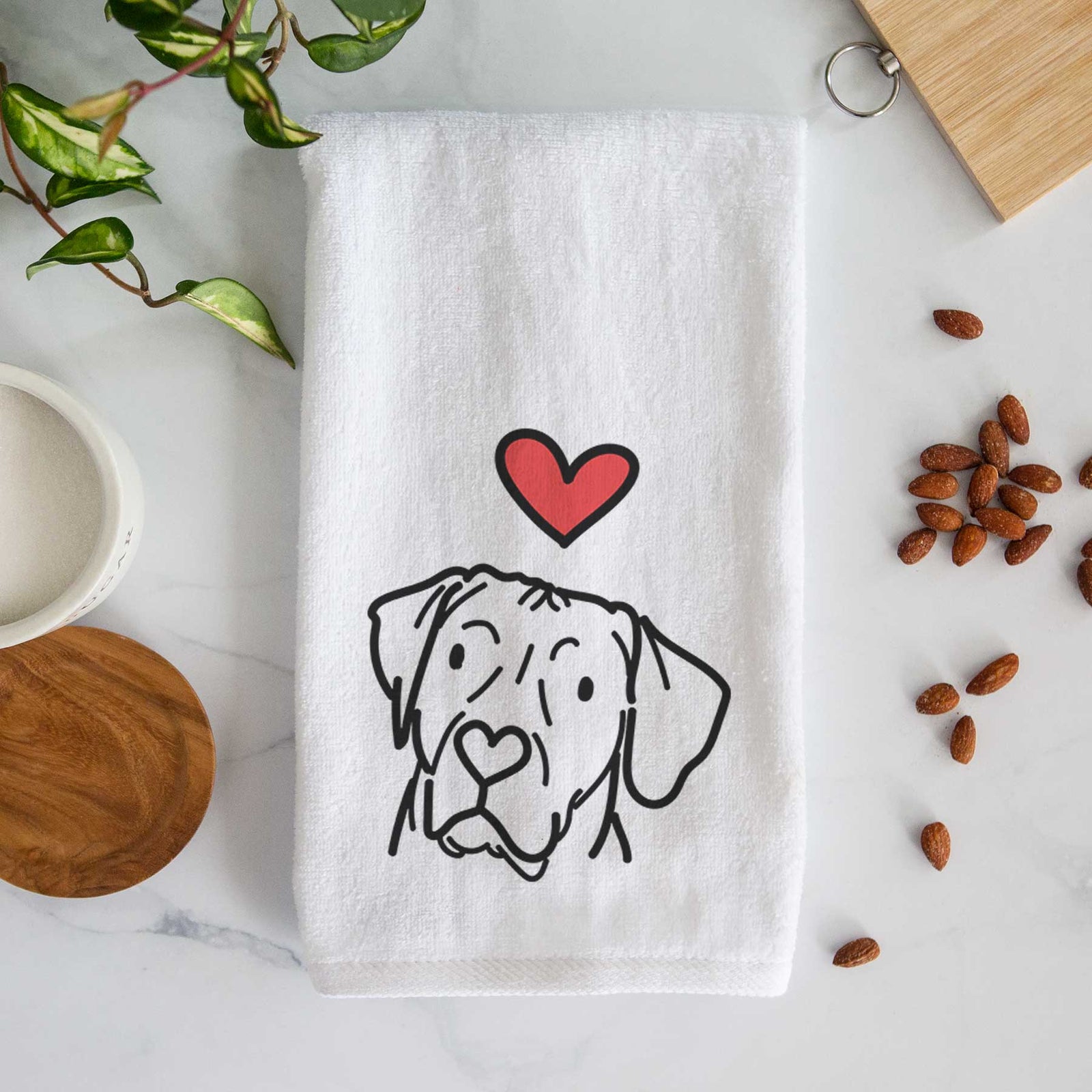 Minimalist line drawing of Tito the Rhodesian Ridgeback with a red heart on a decorative hand towel