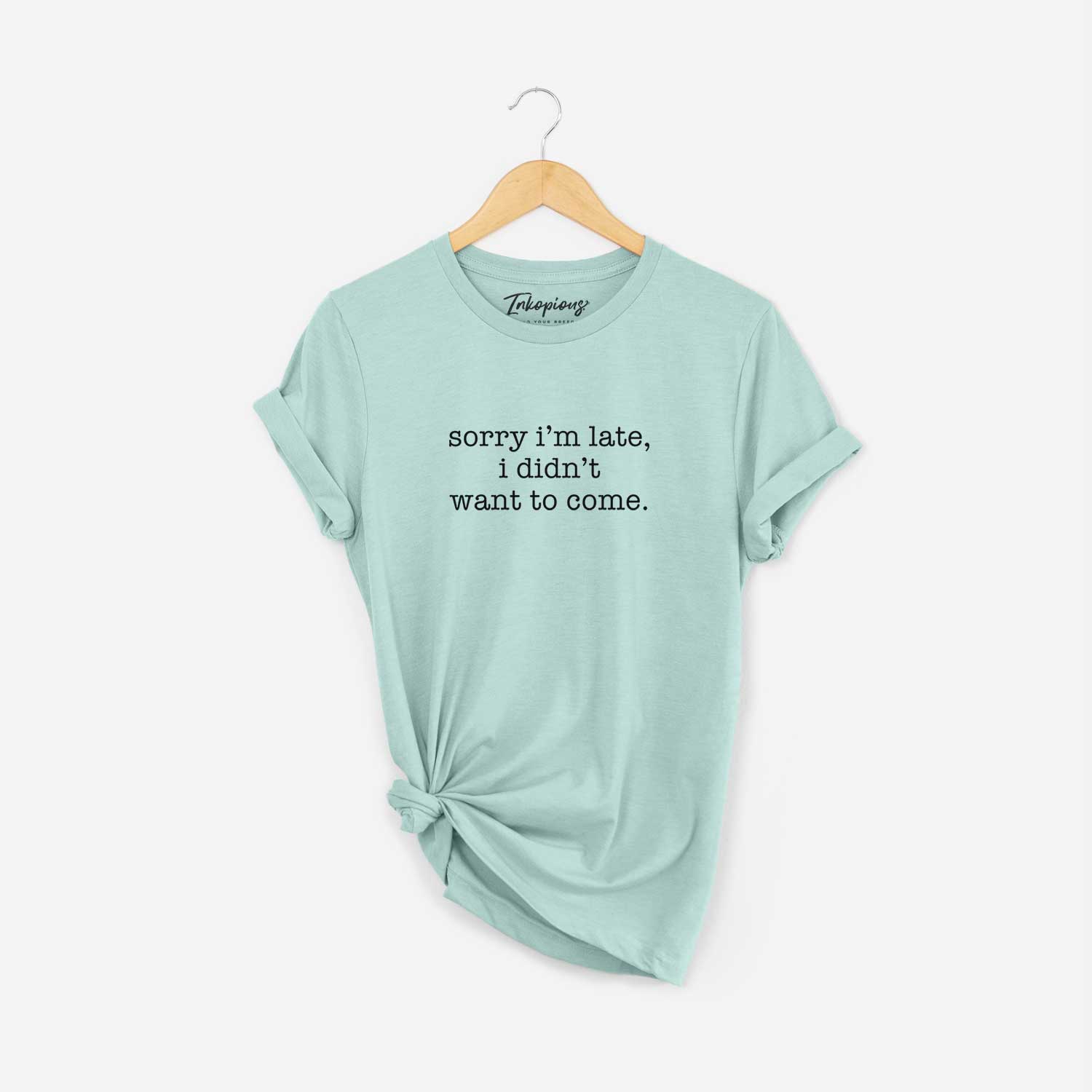 'Sorry I'm Late, I Didn't Want To Come' design on a Heather Sage Unisex crewneck