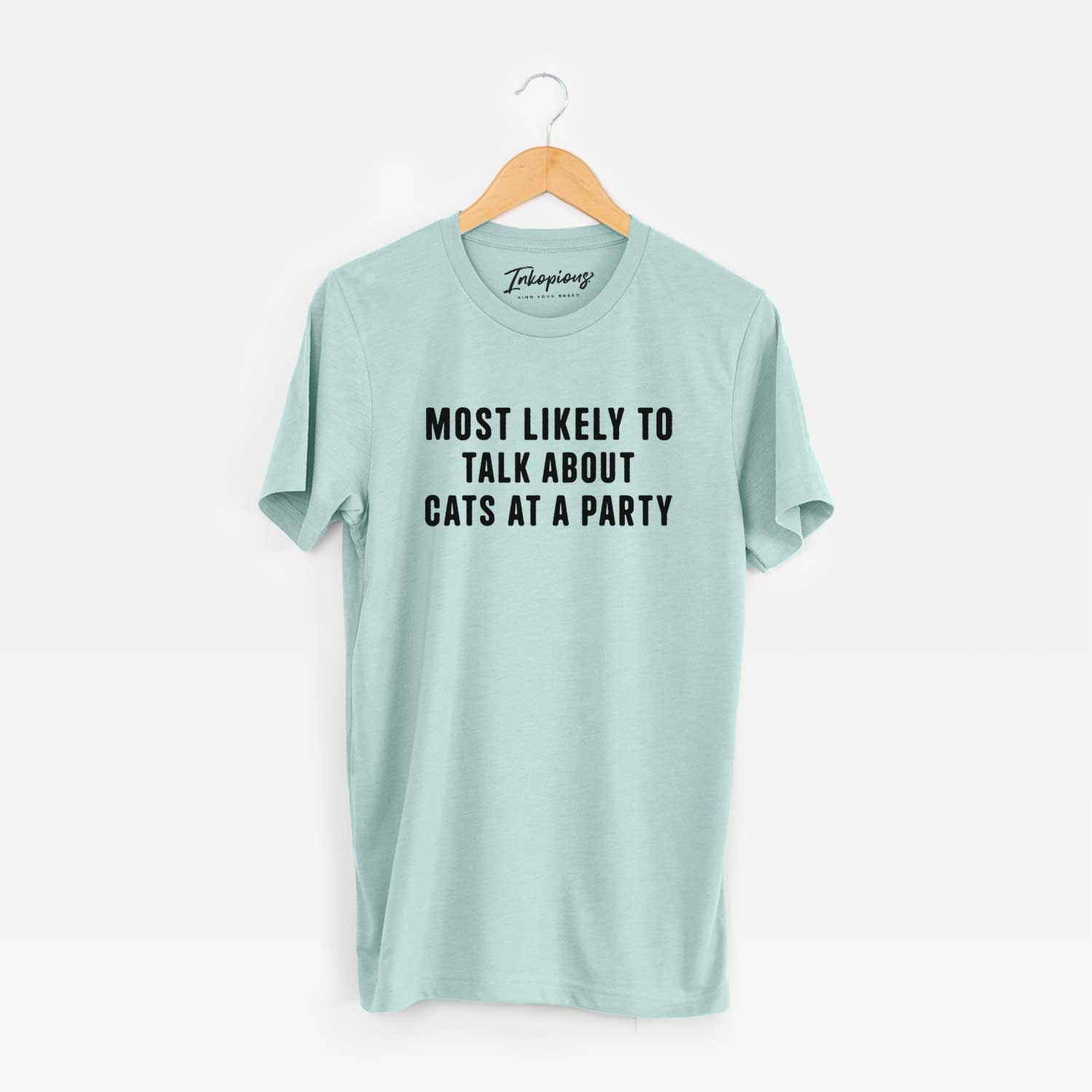 'Most Likely to Talk About Cats at a Party' design on a Heather Sage Unisex crewneck