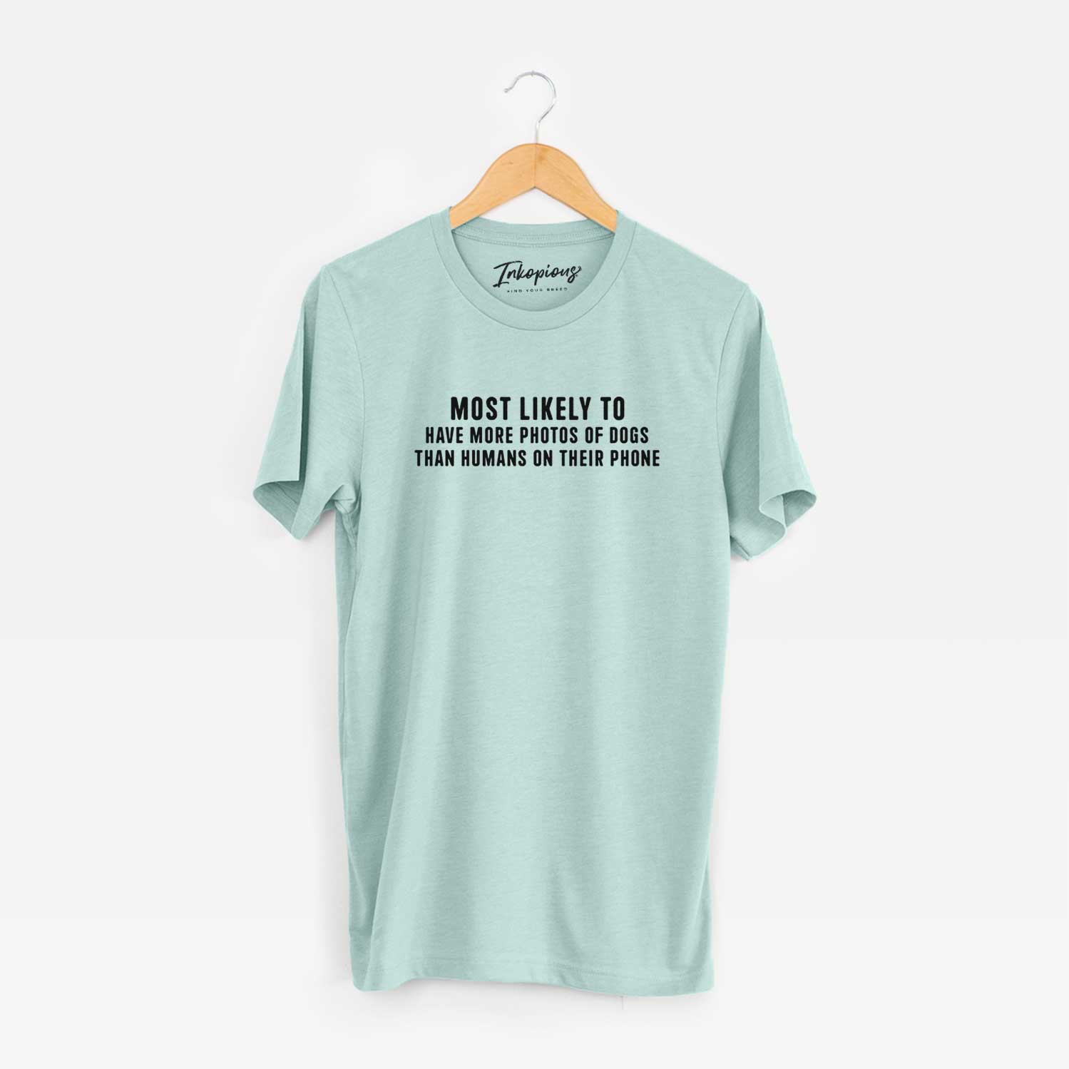 'Most Likely to Have More Photos of Dogs than Humans on their Phone' design on a Heather Sage Unisex crewneck