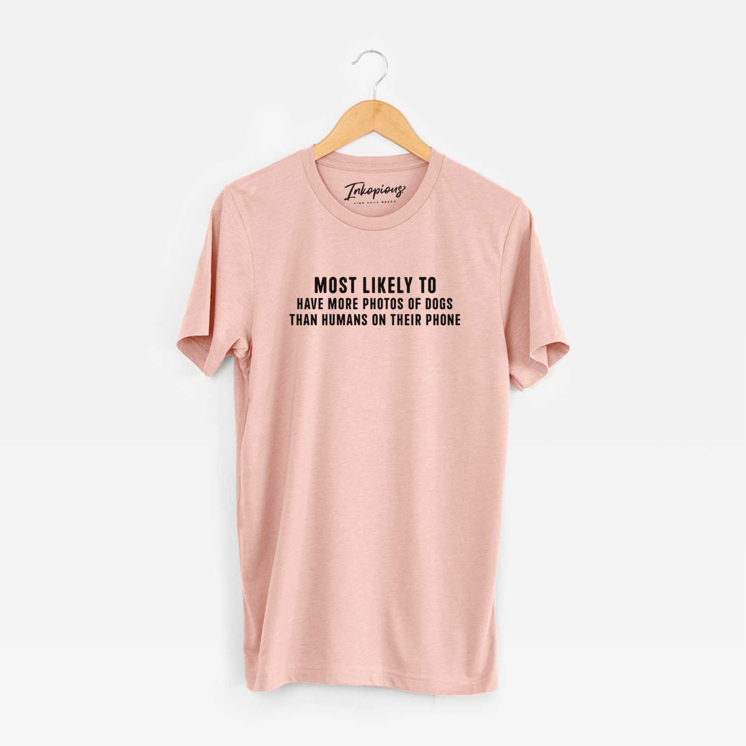 'Most Likely to Have More Photos of Dogs than Humans on their Phone' design on a Peach Unisex crewneck