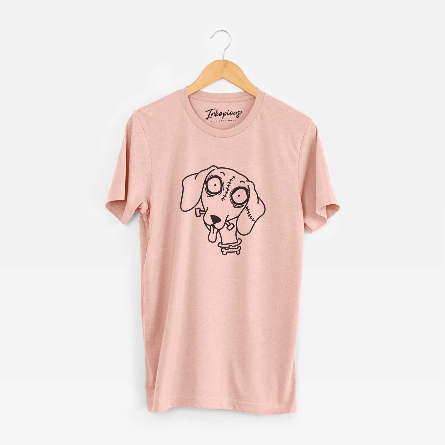 Minimalist line drawing of Dachshund - Nightmare Collection on a Peach Unisex crewneck