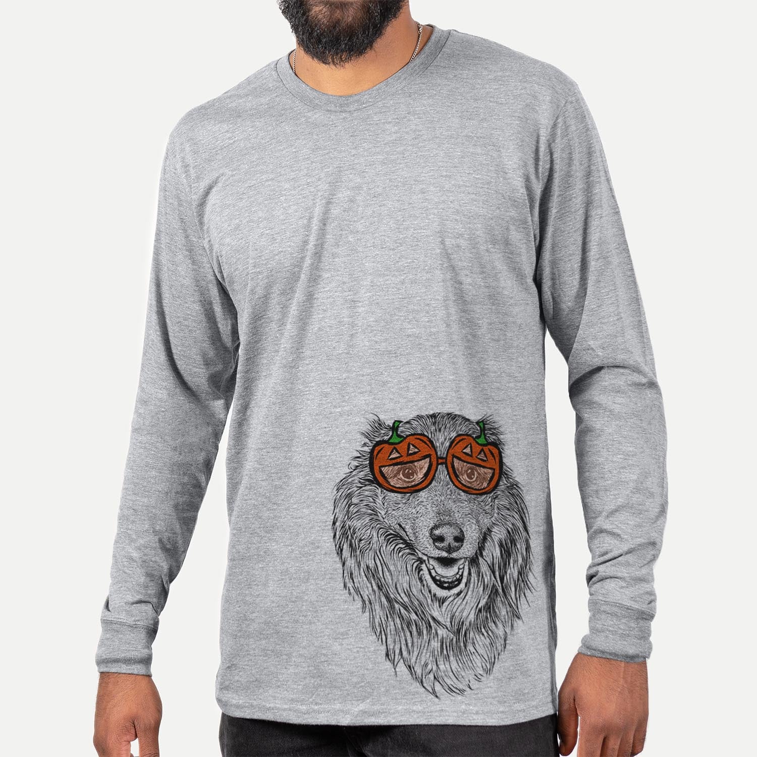Hand-drawn sketch of Addie the Mixed Breed wearing pumpkin glasses on a Grey pumpkin collection, hanging on a wall