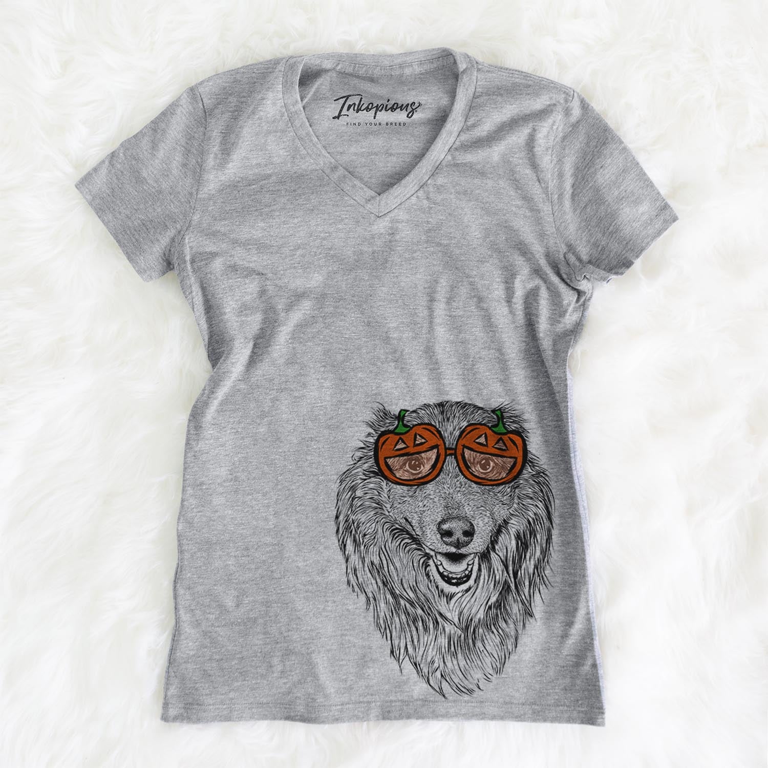 Hand-drawn sketch of Addie the Mixed Breed wearing pumpkin glasses on a Grey pumpkin collection, on a hanger