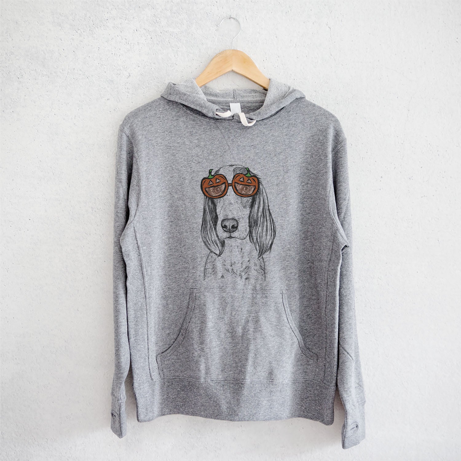 Hand-drawn sketch of Aline the Irish Red and White Setter wearing pumpkin glasses on a Grey pumpkin collection, on a hanger