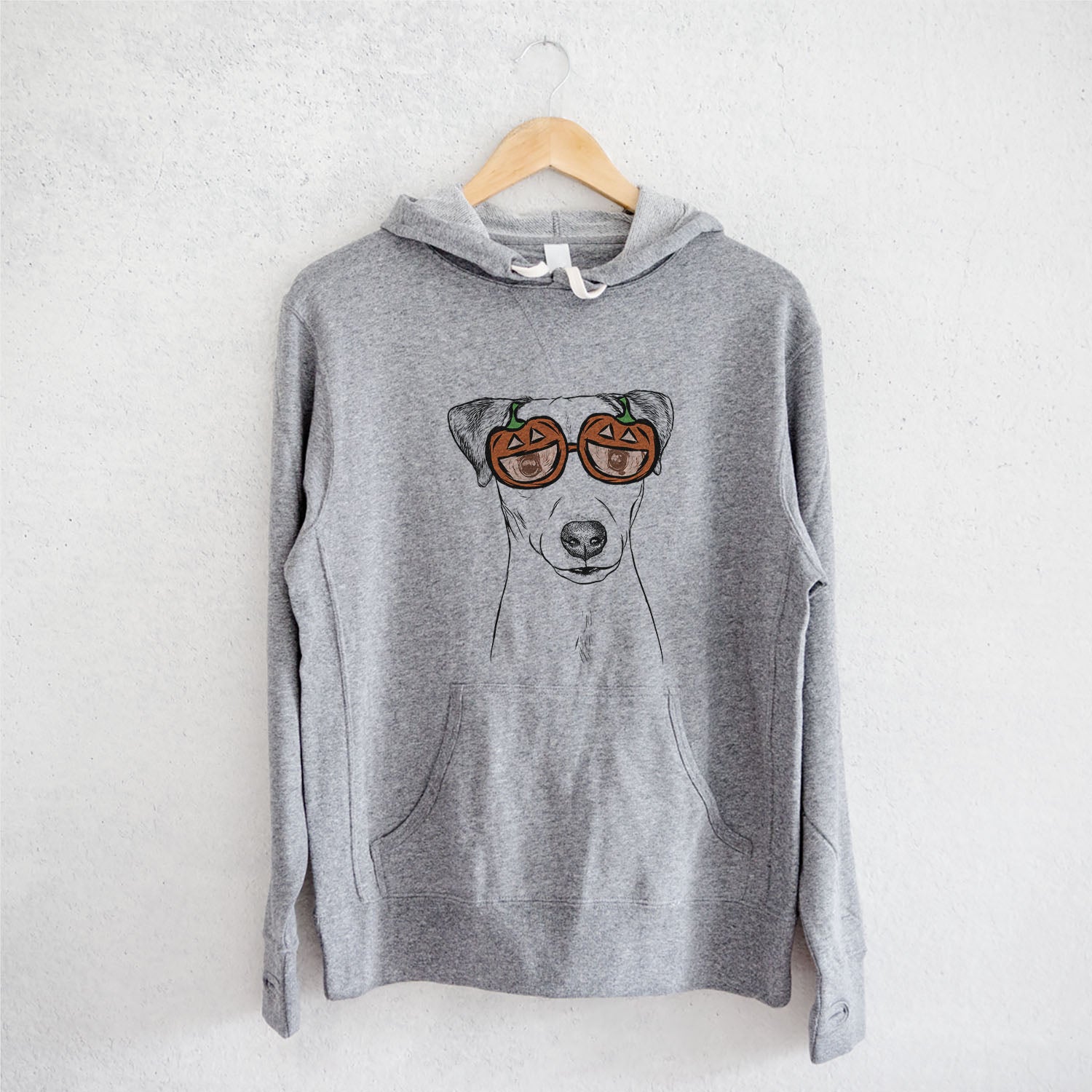 Hand-drawn sketch of Ally the Jack Russell Terrier wearing pumpkin glasses on a Grey pumpkin collection, on a hanger