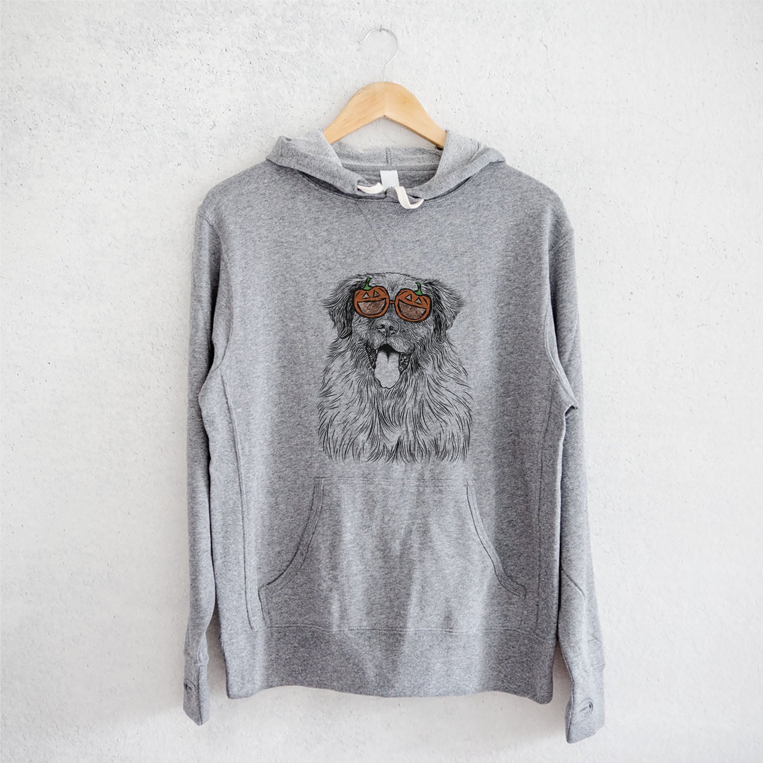 Hand-drawn sketch of Bamboo the Leonberger wearing pumpkin glasses on a Grey pumpkin collection, on a hanger