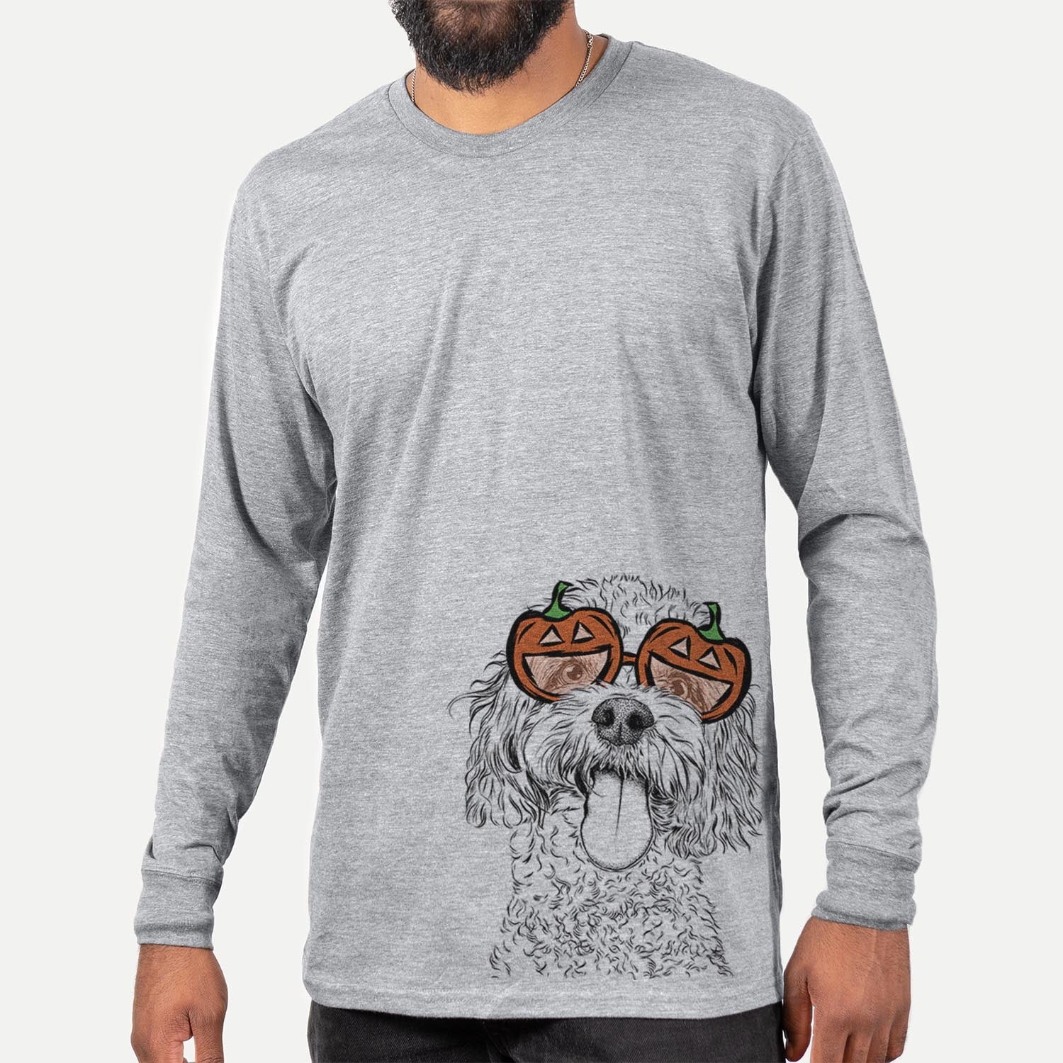 Hand-drawn sketch of Barney the Cavachon wearing pumpkin glasses on a Grey pumpkin collection, hanging on a wall