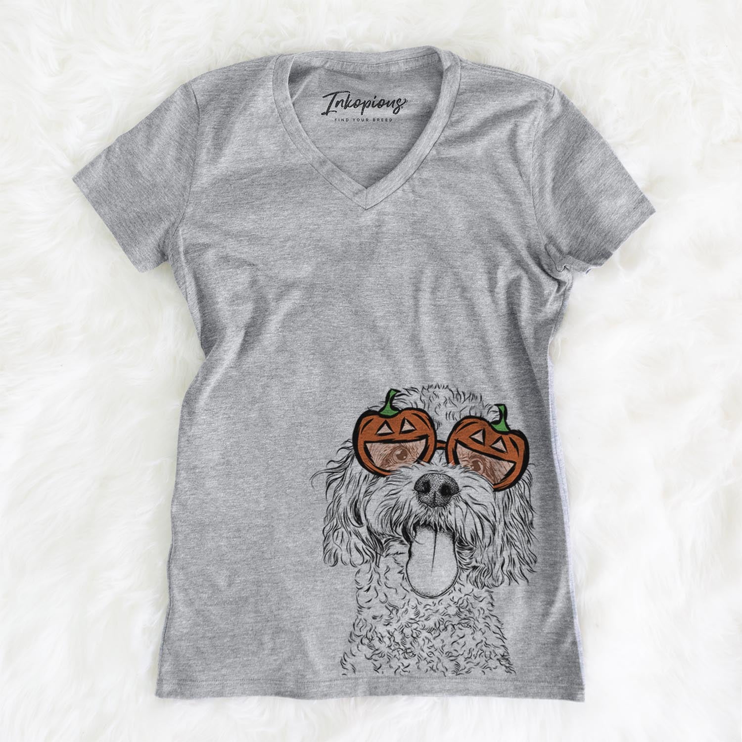 Hand-drawn sketch of Barney the Cavachon wearing pumpkin glasses on a Grey pumpkin collection, on a hanger