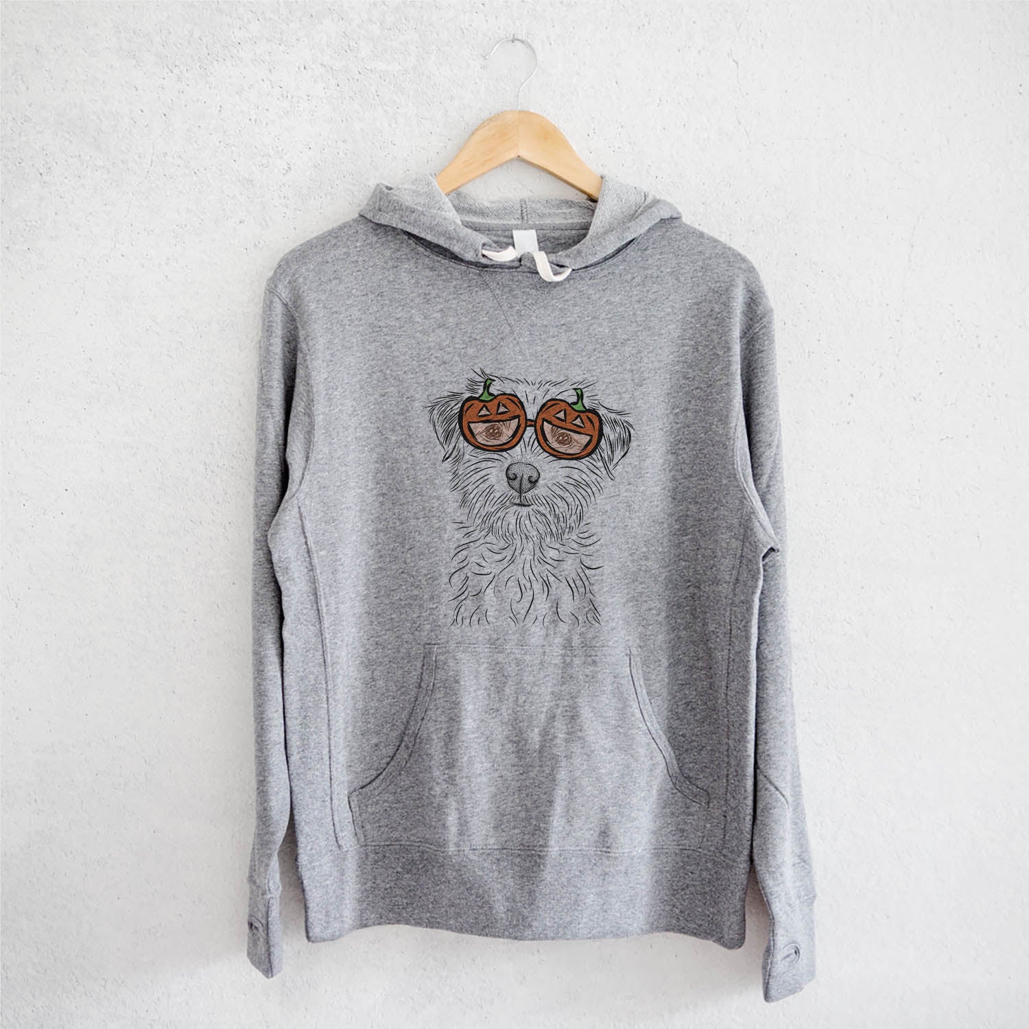 Hand-drawn sketch of Benjamin the Border Terrier wearing pumpkin glasses on a Grey pumpkin collection, on a hanger