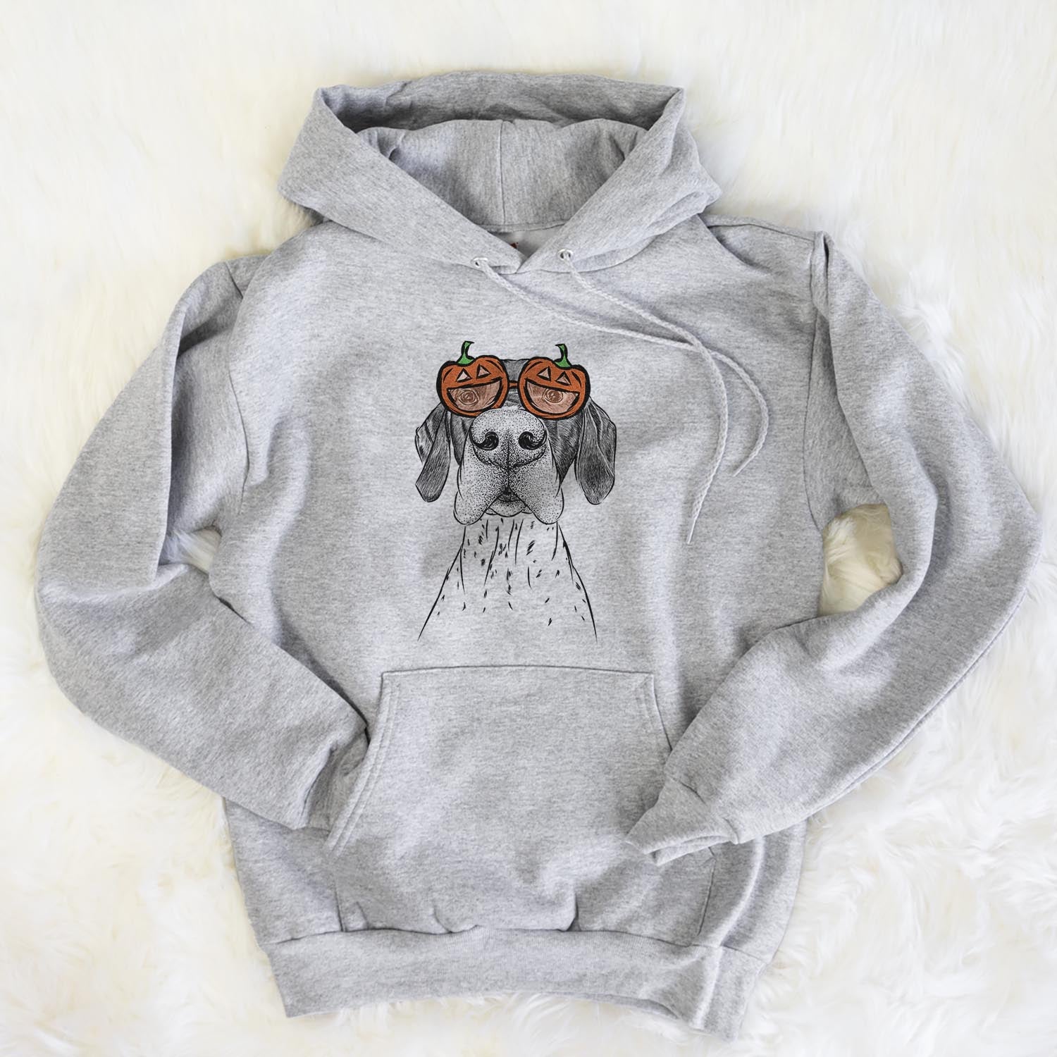 Hand-drawn sketch of Booze the German Shorthaired Pointer wearing pumpkin glasses on a Grey pumpkin collection, flat lay